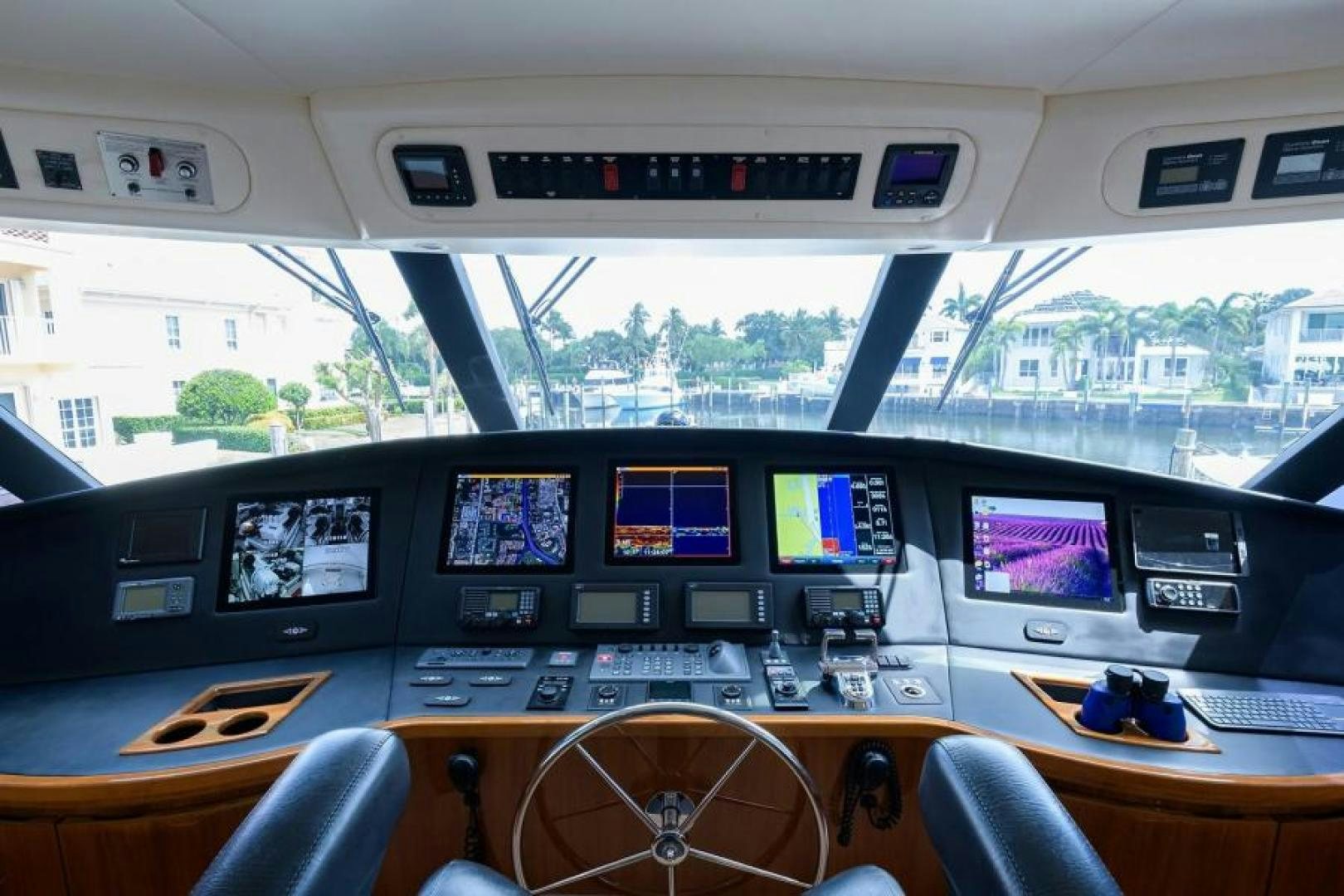 a control room with many monitors aboard OSH IT Yacht for Sale