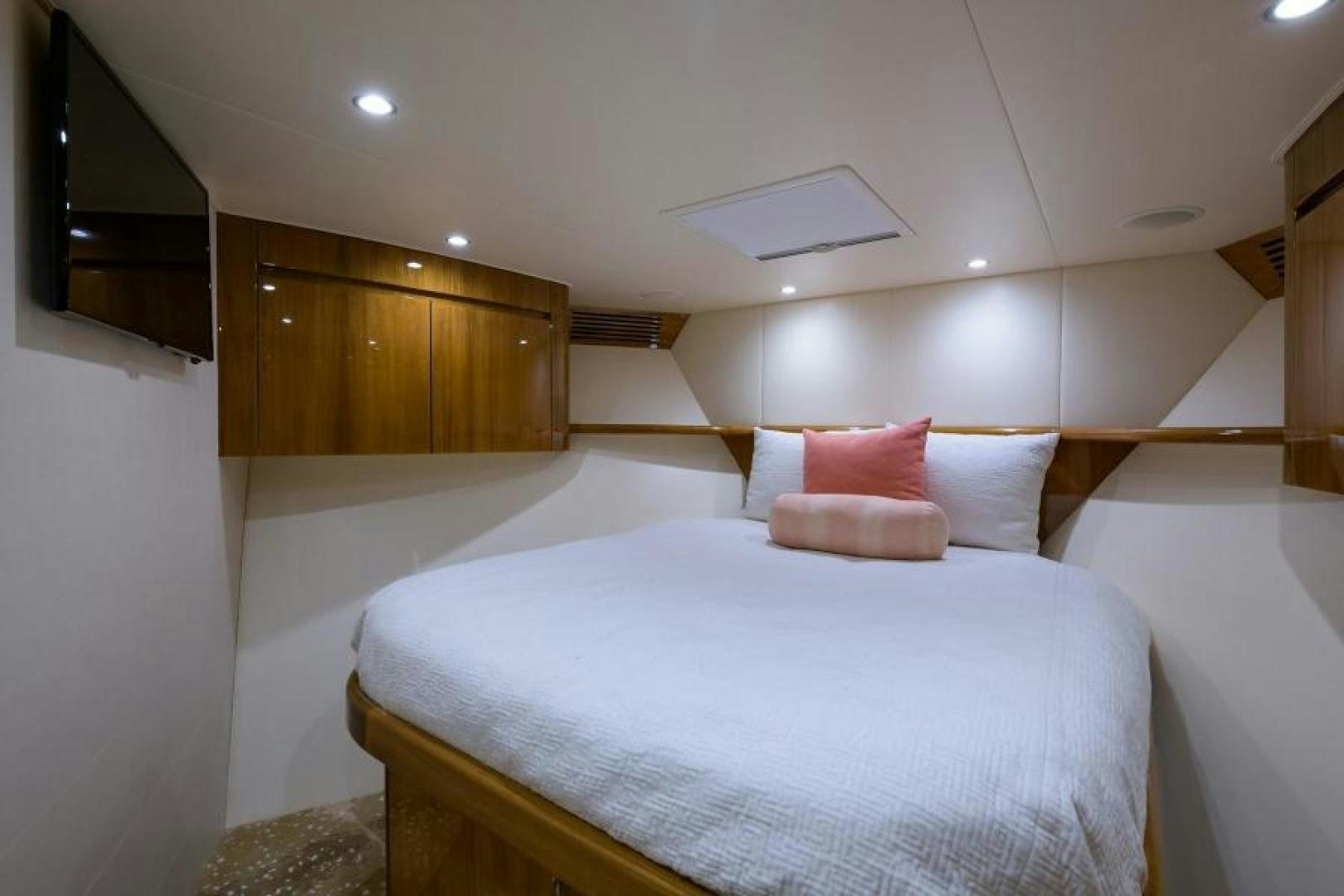 a bed with white sheets aboard OSH IT Yacht for Sale