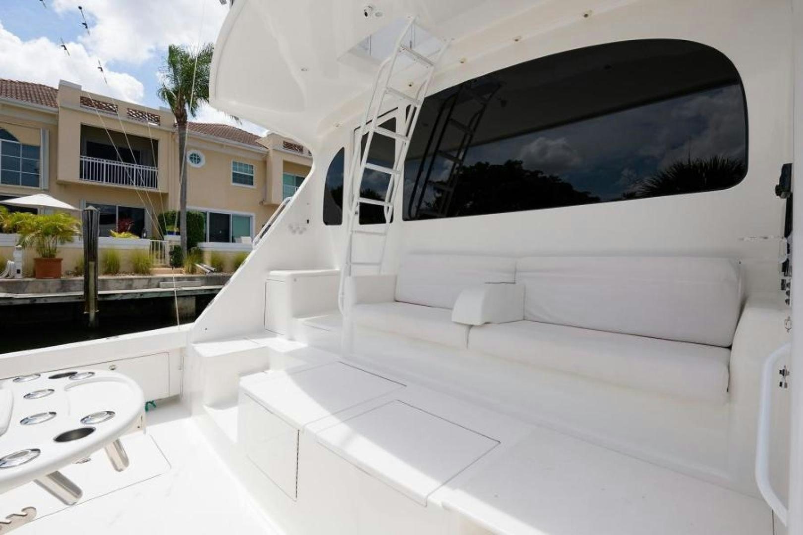 a white car with a black hood aboard OSH IT Yacht for Sale