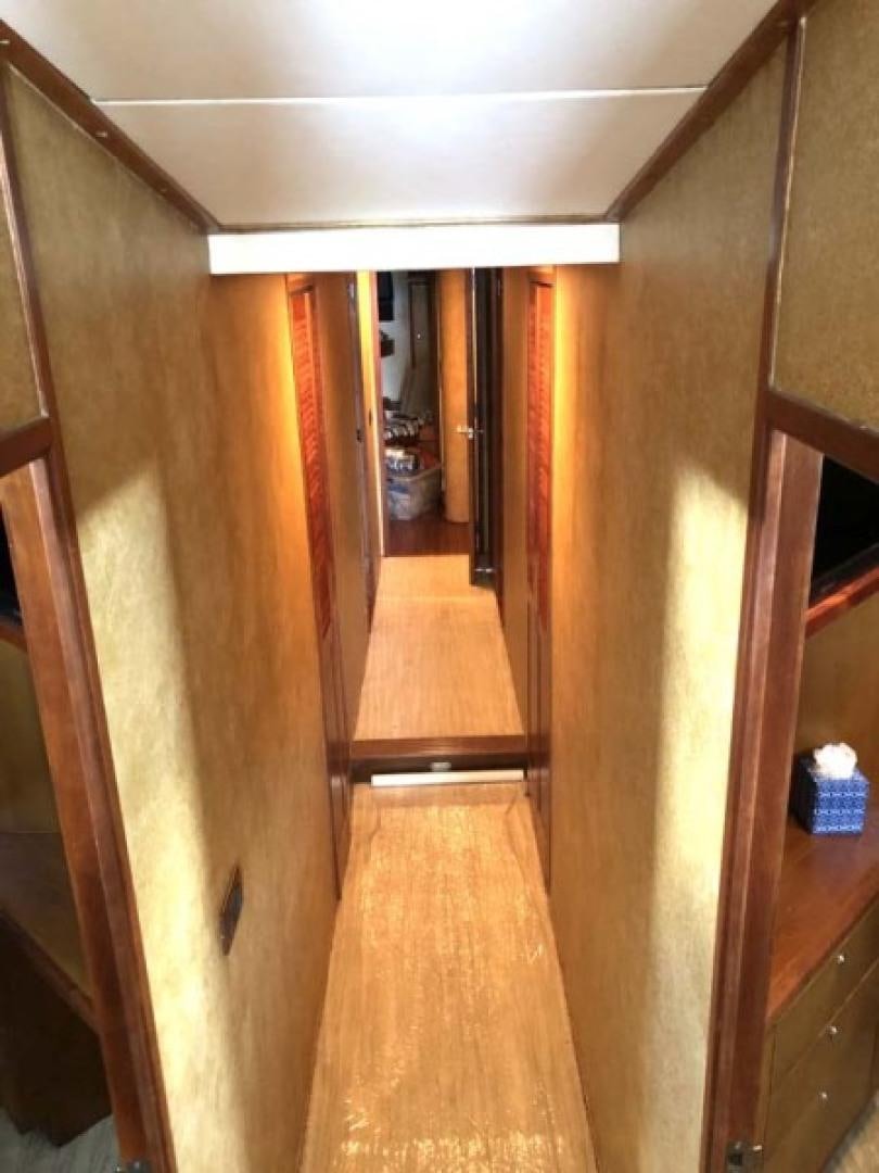 a hallway with wood floors aboard PRIME TIME Yacht for Sale