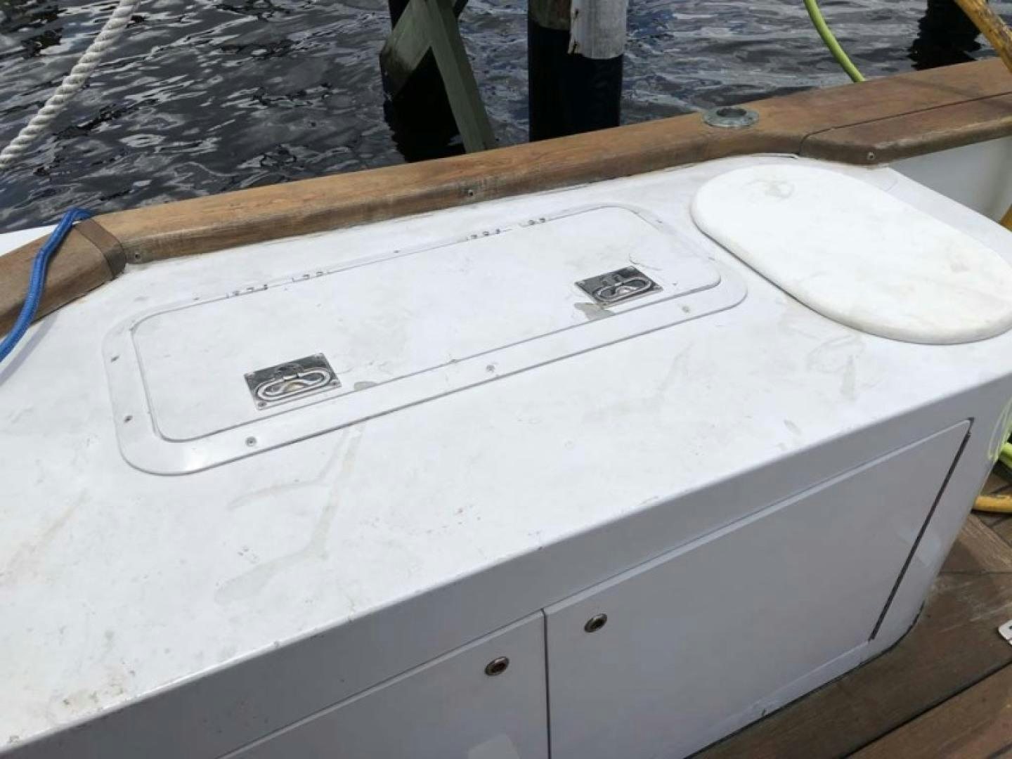 a white boat on a dock aboard PRIME TIME Yacht for Sale