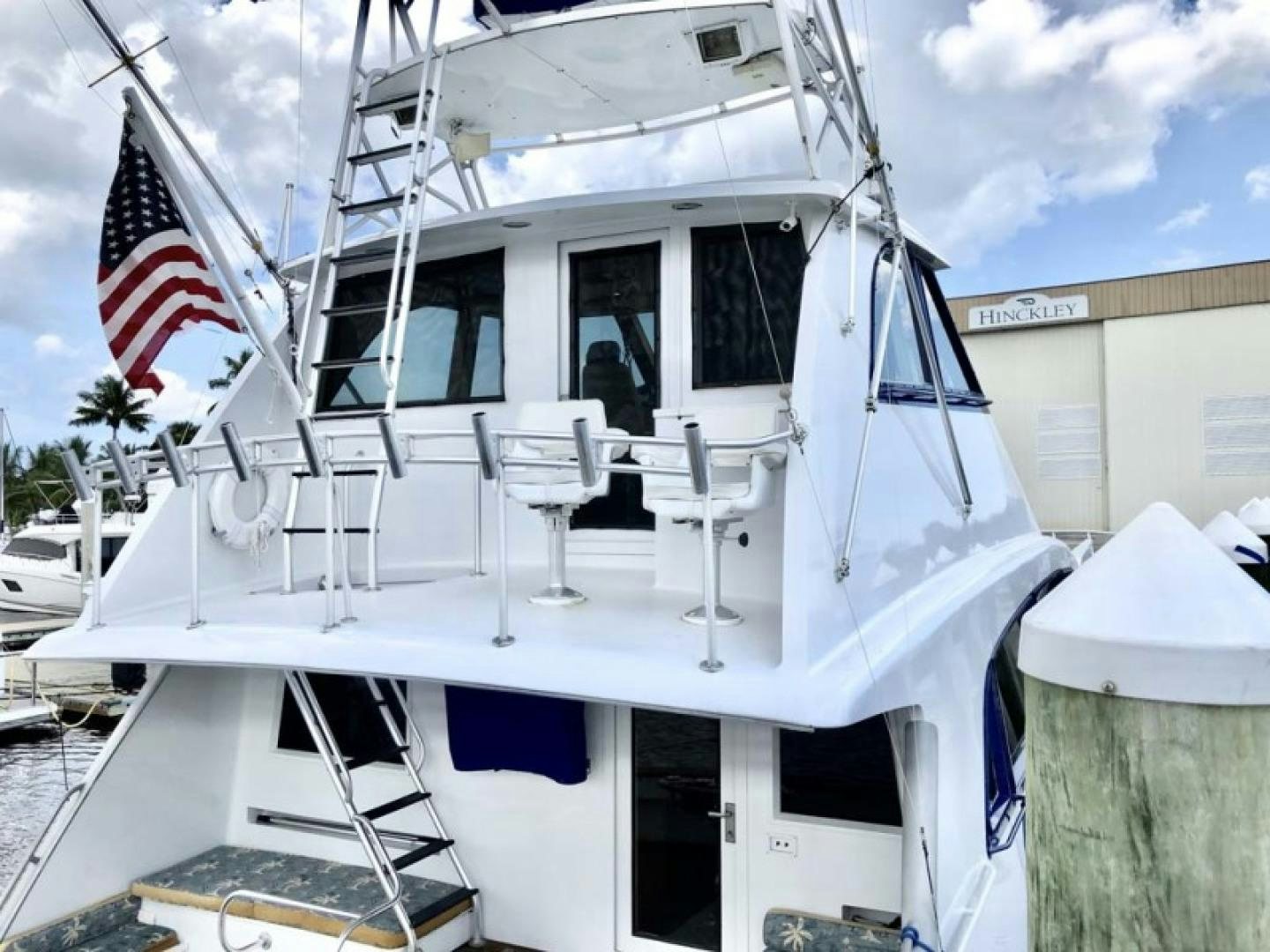 a boat with a flag on the front aboard PRIME TIME Yacht for Sale