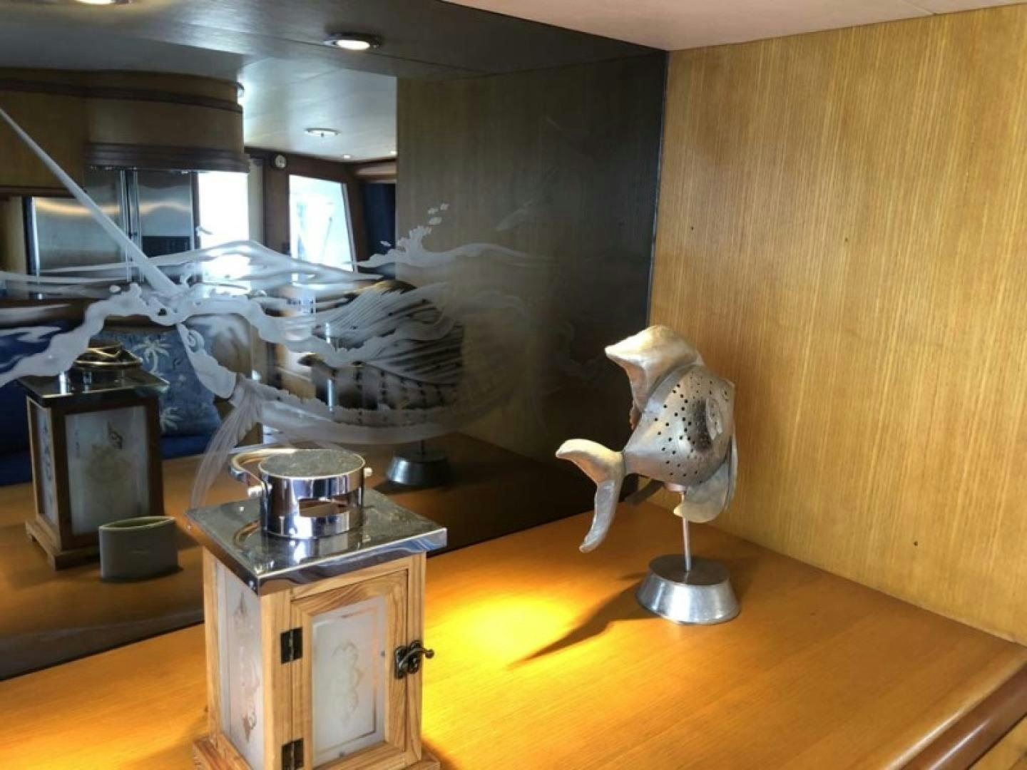 a kitchen with a large statue aboard PRIME TIME Yacht for Sale