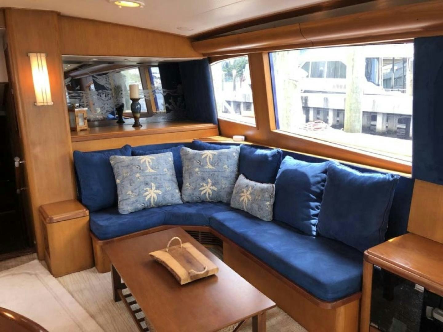 a living room with a blue couch aboard PRIME TIME Yacht for Sale