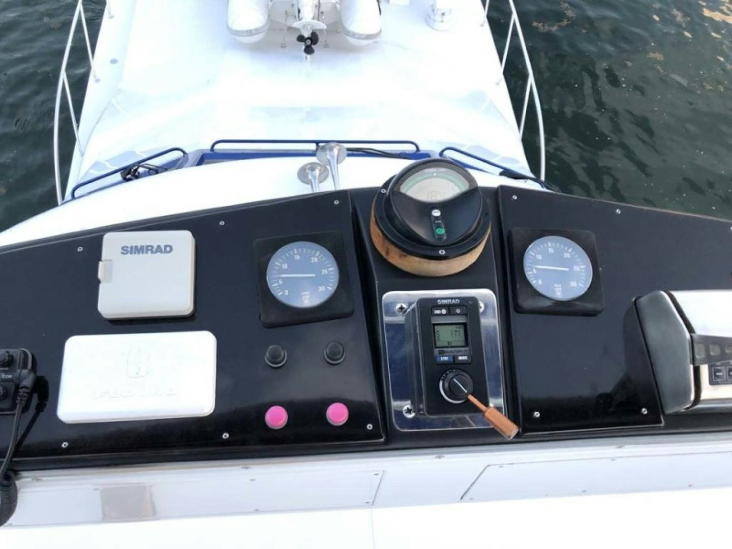a car dashboard with a steering wheel and dashboard aboard PRIME TIME Yacht for Sale