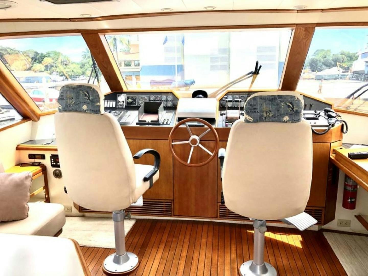 a room with a couple of chairs and a table with a computer on it aboard PRIME TIME Yacht for Sale