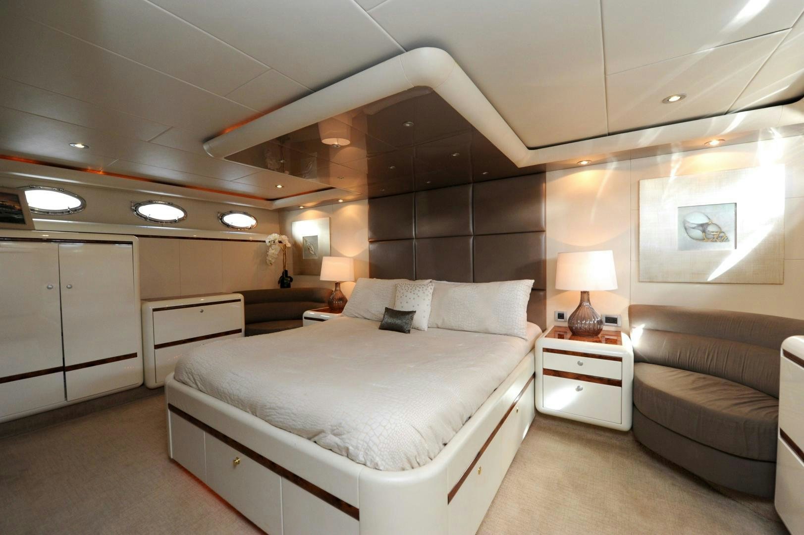 a large bedroom with a bed aboard PLAN B Yacht for Sale