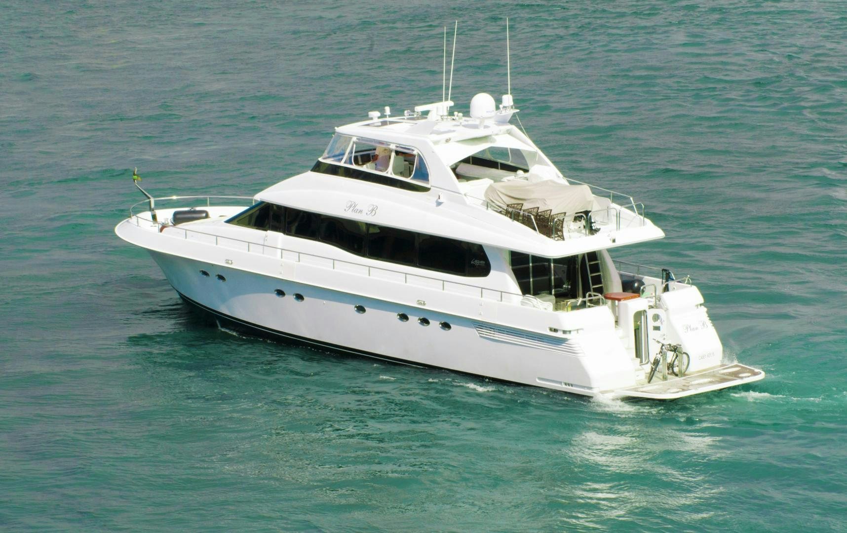 a white yacht in the water aboard PLAN B Yacht for Sale