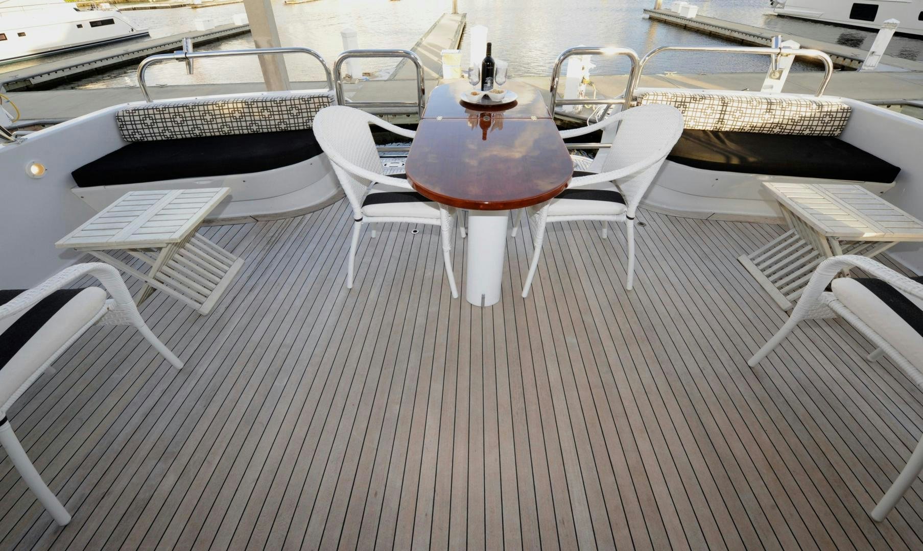 a table with chairs around it aboard PLAN B Yacht for Sale