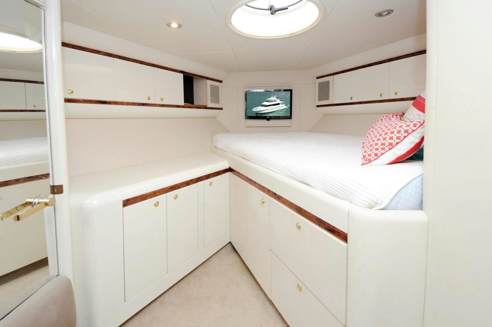 a small bedroom with a bed aboard PLAN B Yacht for Sale