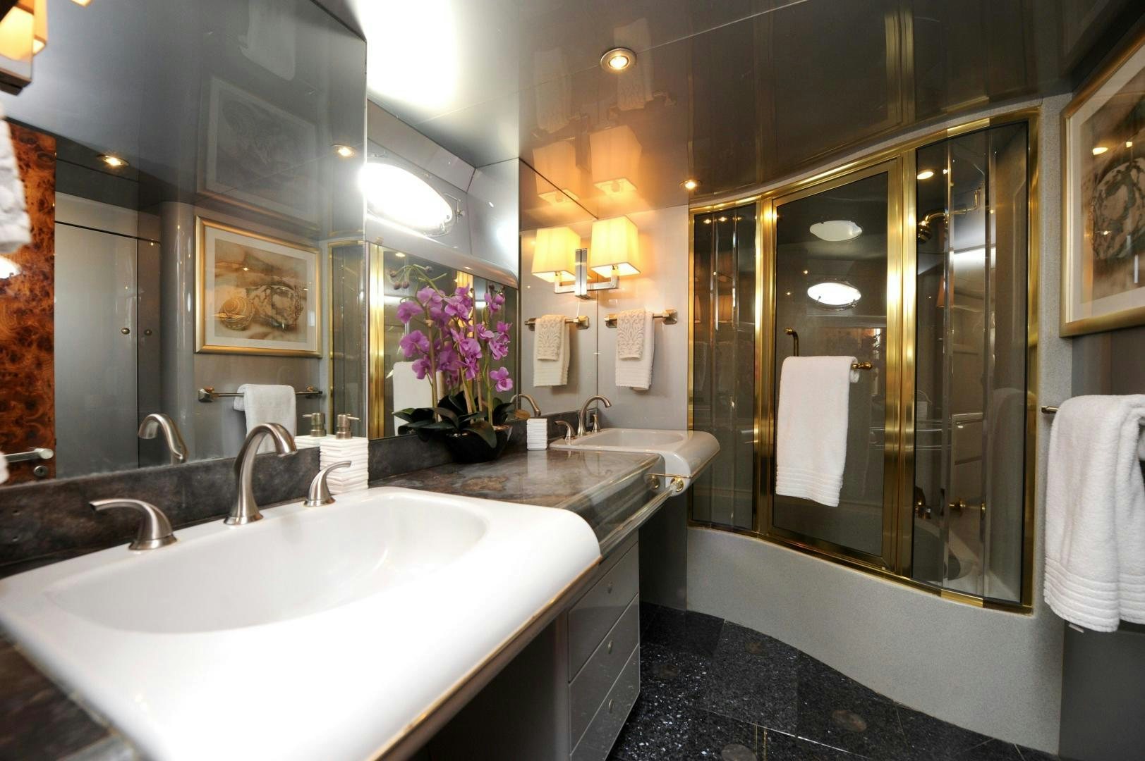a bathroom with a large mirror aboard PLAN B Yacht for Sale