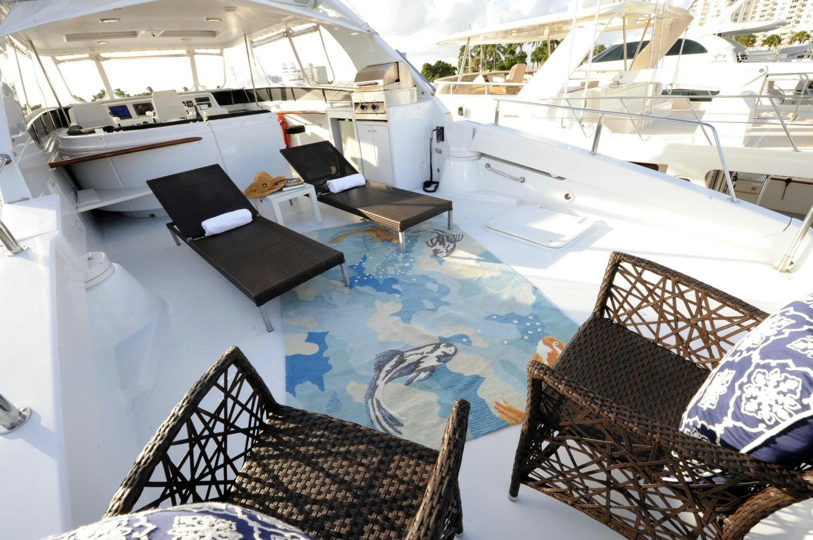 a room with a pool table and chairs aboard PLAN B Yacht for Sale