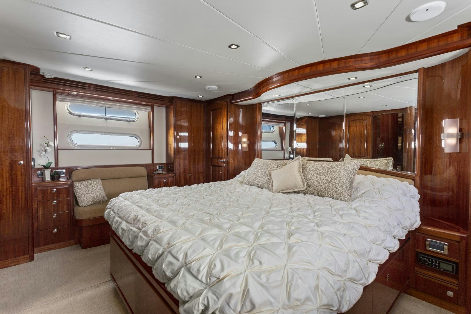 a large bed in a room aboard ODYSEA Yacht for Sale