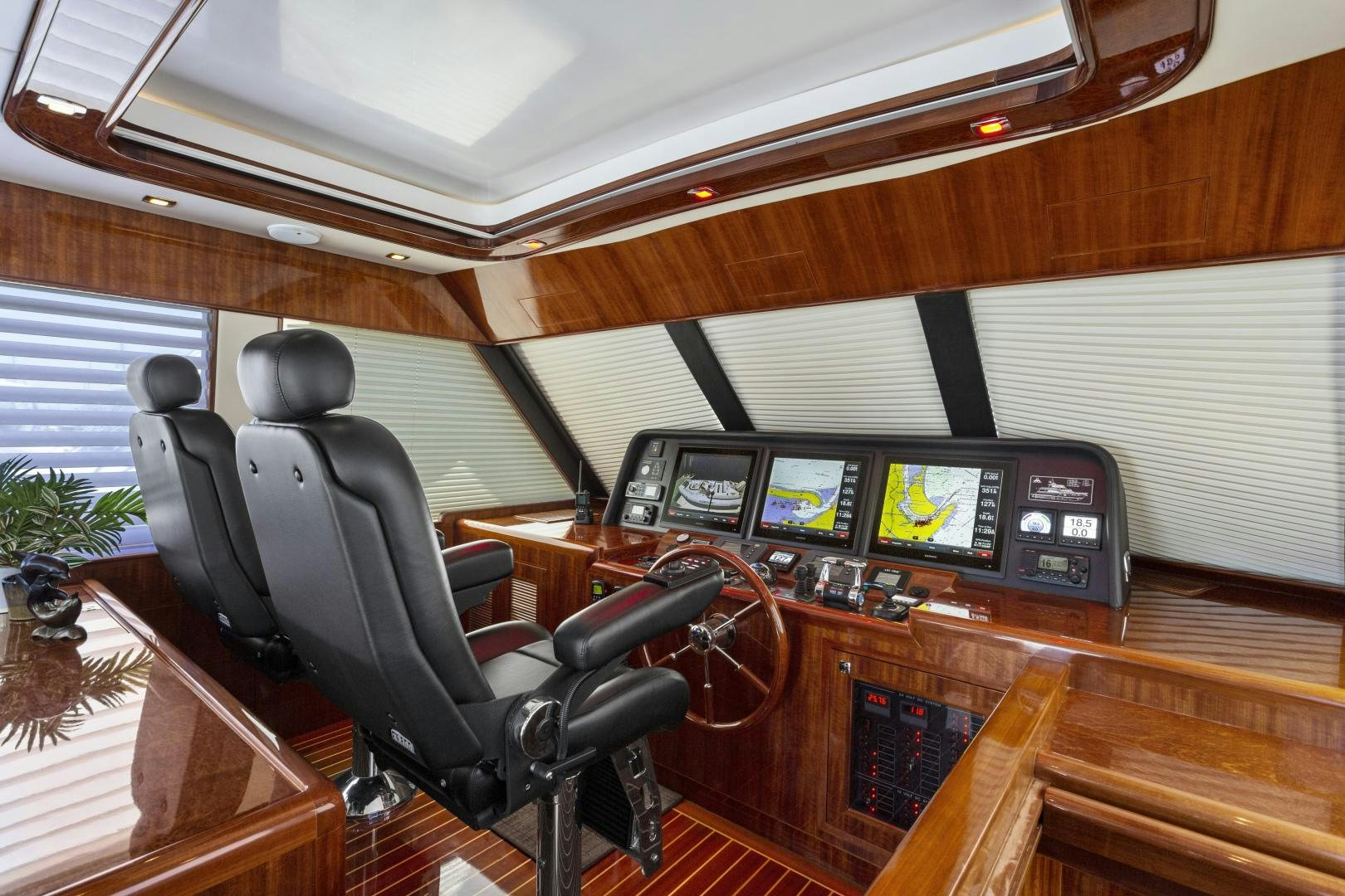 a room with a desk and computer aboard ODYSEA Yacht for Sale