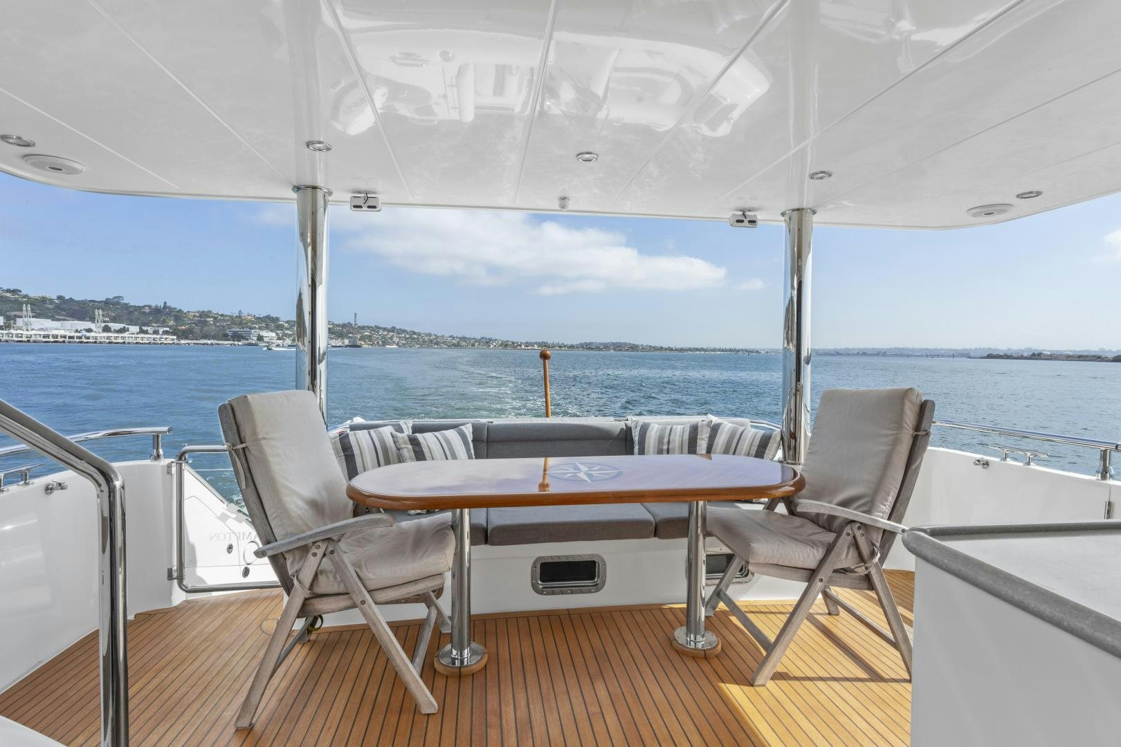 a table and chairs on a boat aboard ODYSEA Yacht for Sale