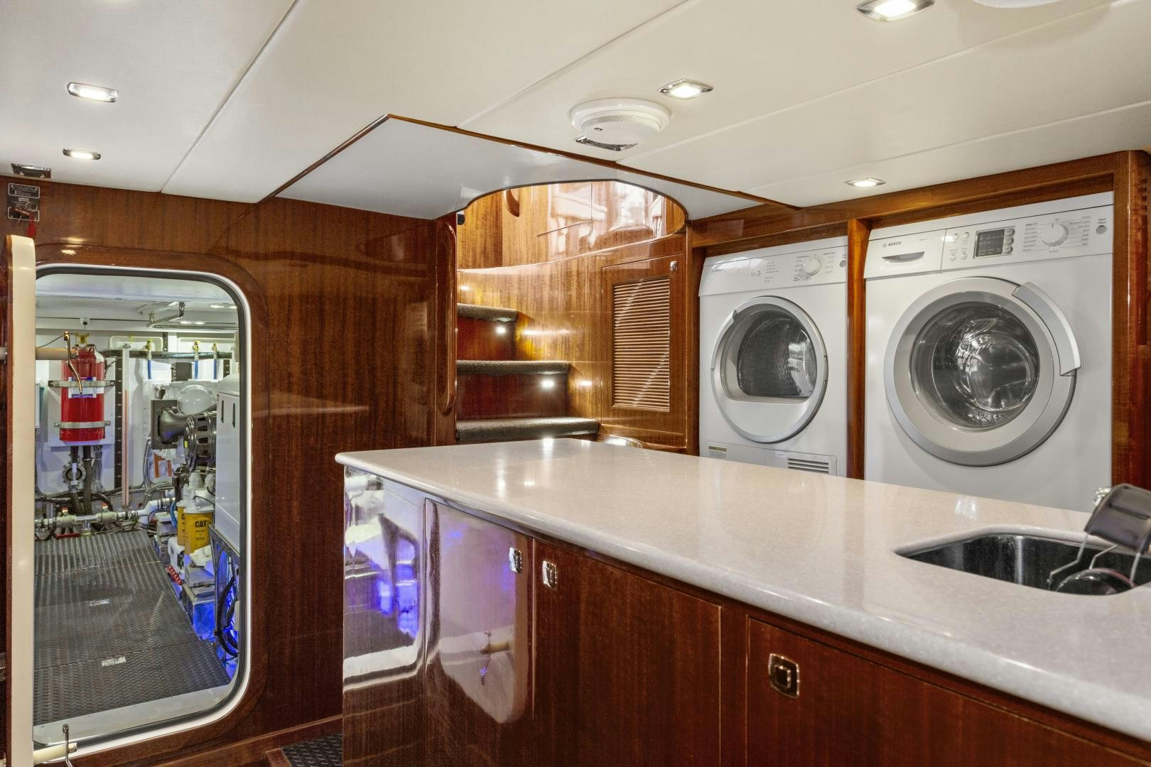 a kitchen with a washing machine aboard ODYSEA Yacht for Sale