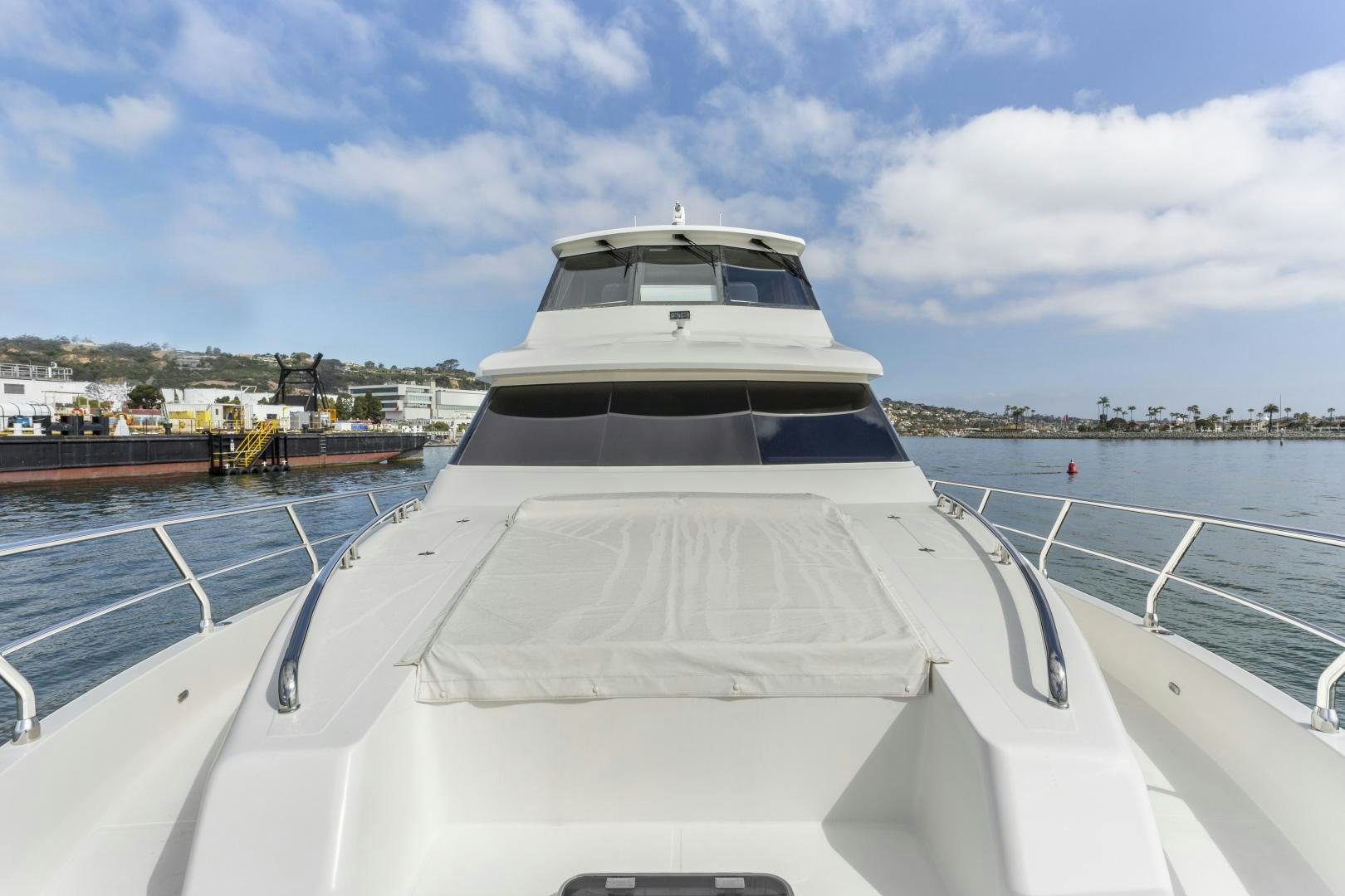 a white yacht on a dock aboard ODYSEA Yacht for Sale