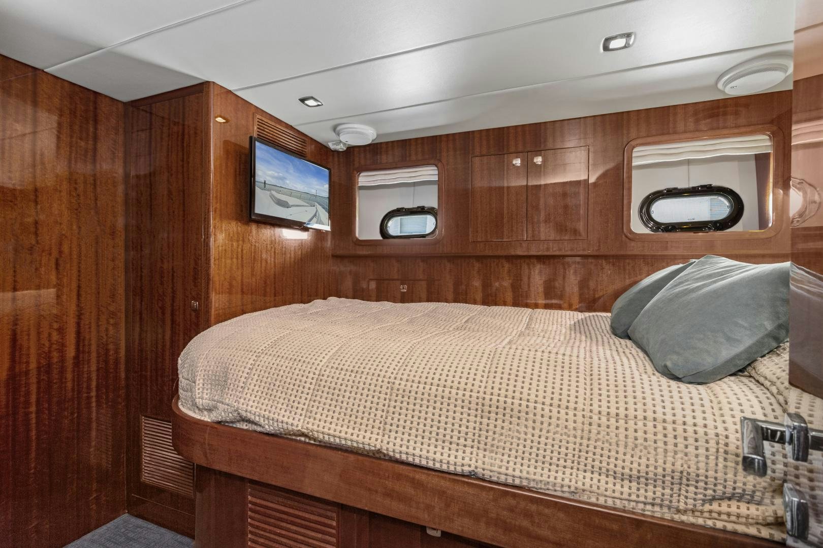 a bed in a room aboard ODYSEA Yacht for Sale