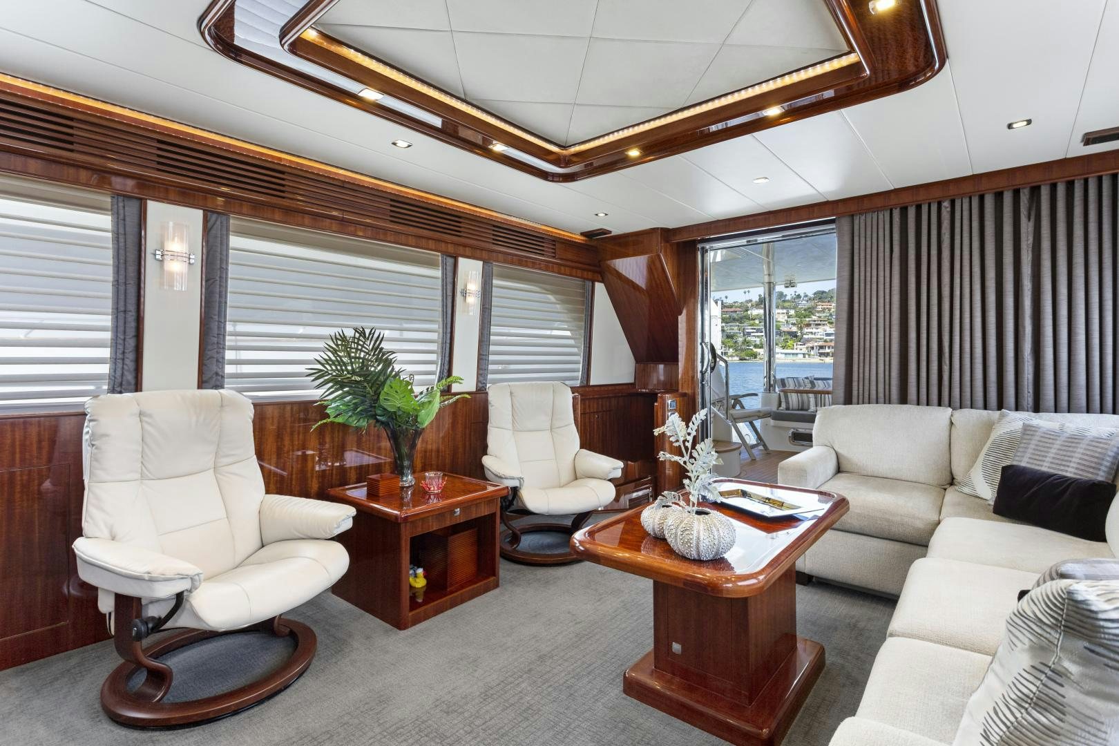 a living room with a large window aboard ODYSEA Yacht for Sale