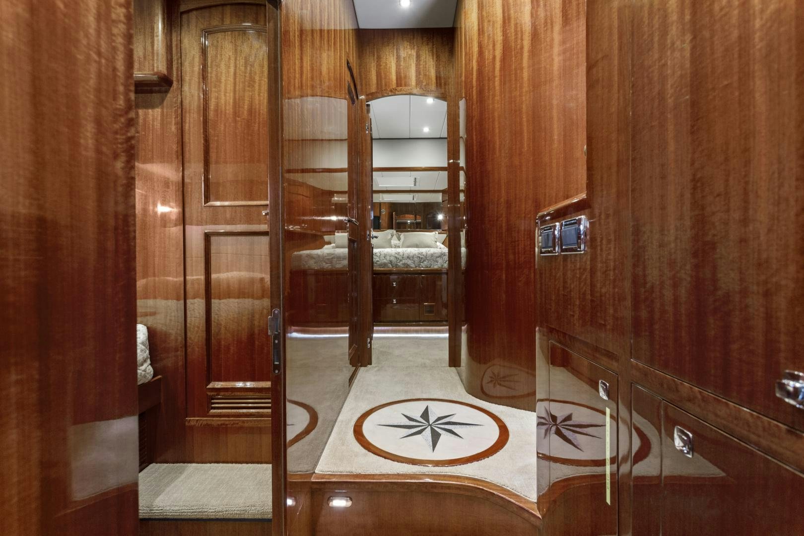 a wooden bathroom with a large wooden closet aboard ODYSEA Yacht for Sale