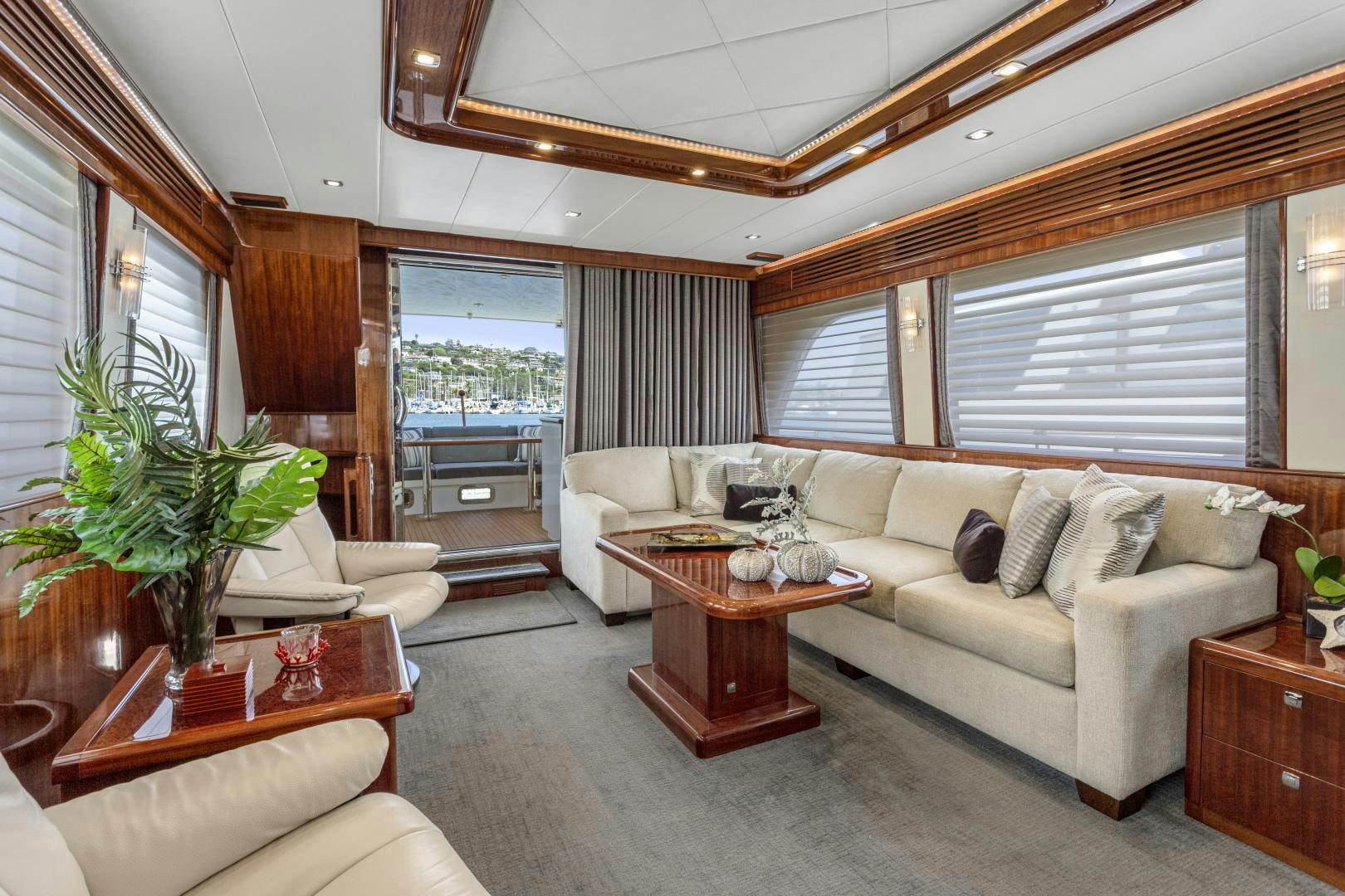 a living room with a couch and a coffee table aboard ODYSEA Yacht for Sale