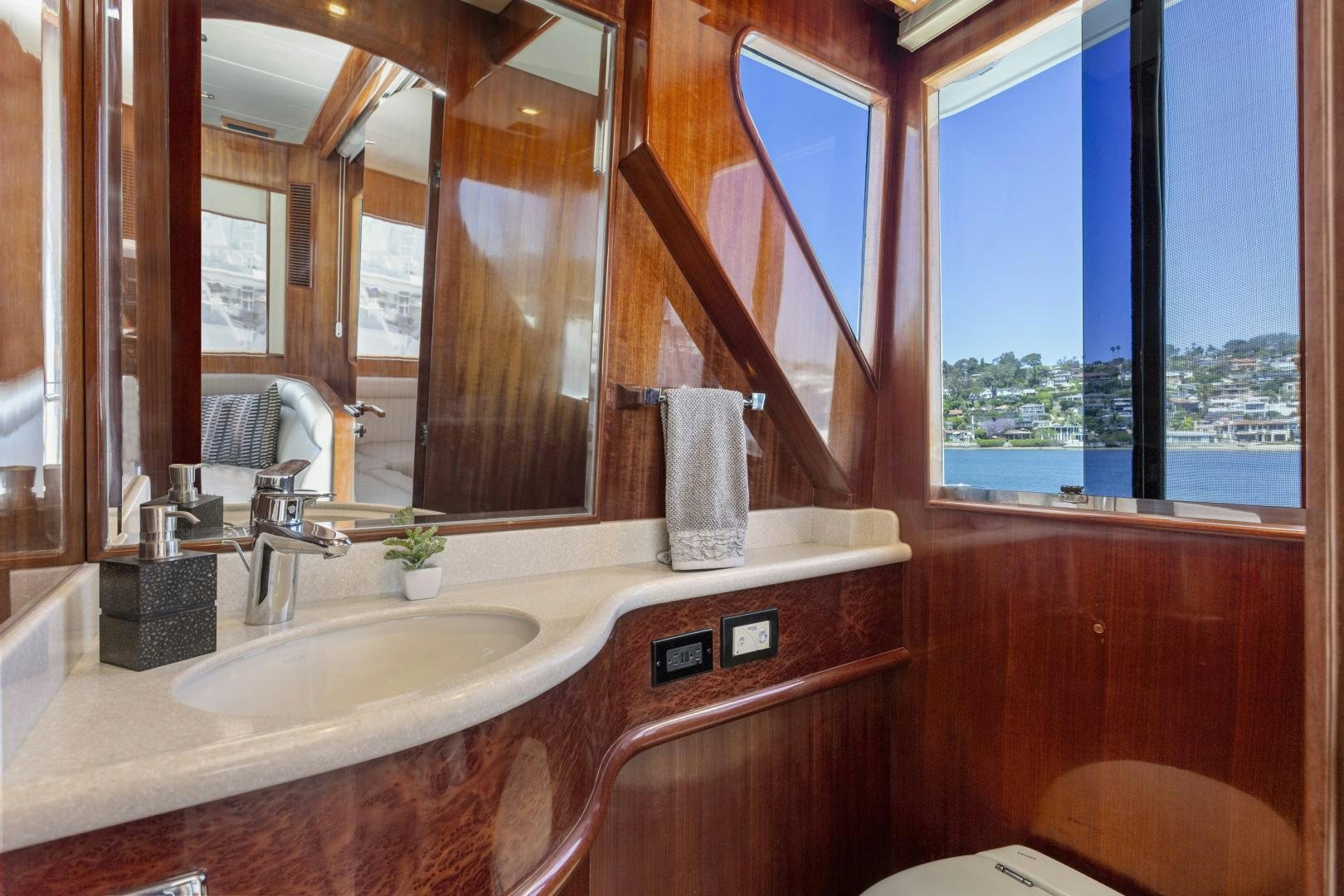 a bathroom with a large mirror aboard ODYSEA Yacht for Sale