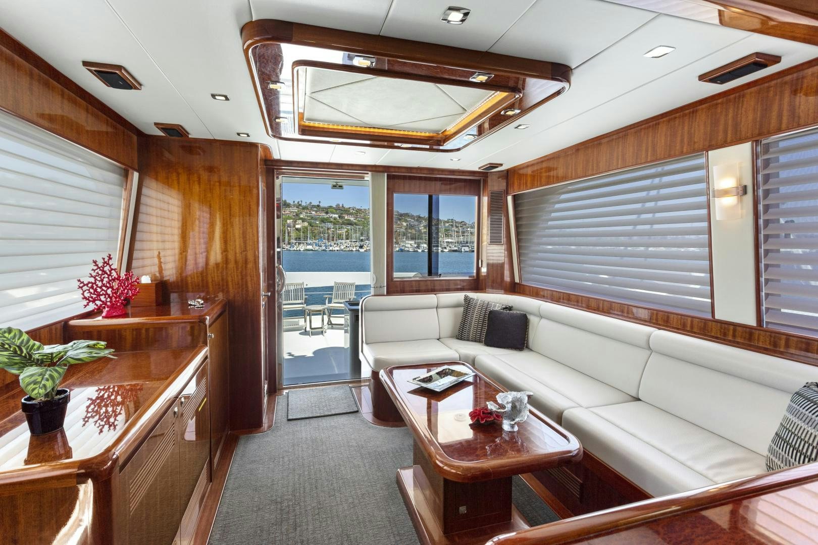 a living room with a couch and a table aboard ODYSEA Yacht for Sale