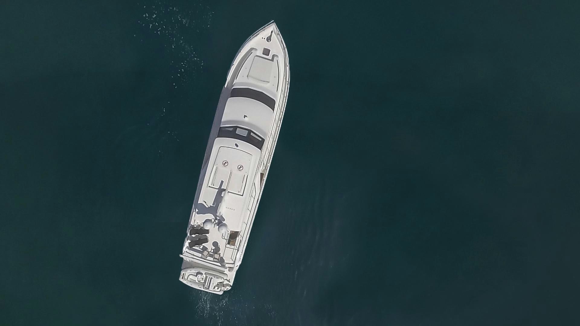 a white boat in the water aboard ODYSEA Yacht for Sale