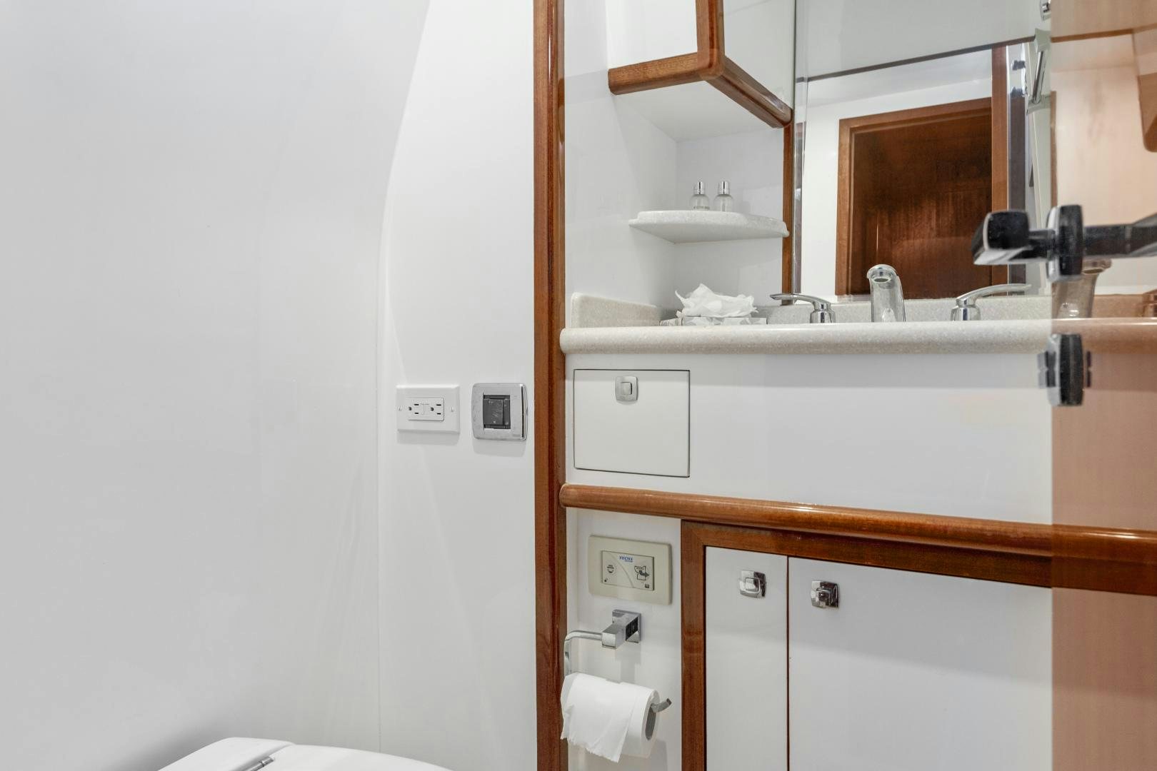 a bathroom with a sink and mirror aboard ODYSEA Yacht for Sale