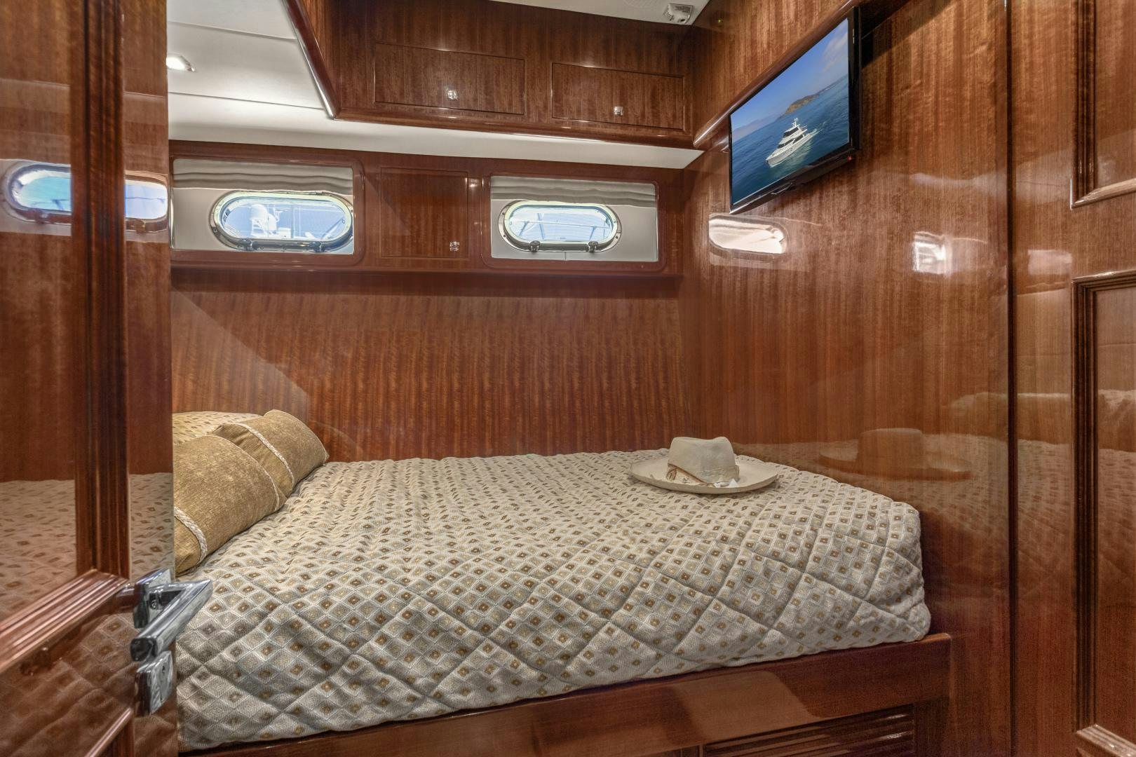 a bed in a room aboard ODYSEA Yacht for Sale