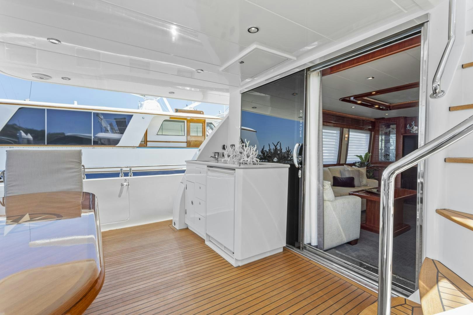 a room with a wood floor and a white cabinet with a white cabinet and a wood floor with aboard ODYSEA Yacht for Sale