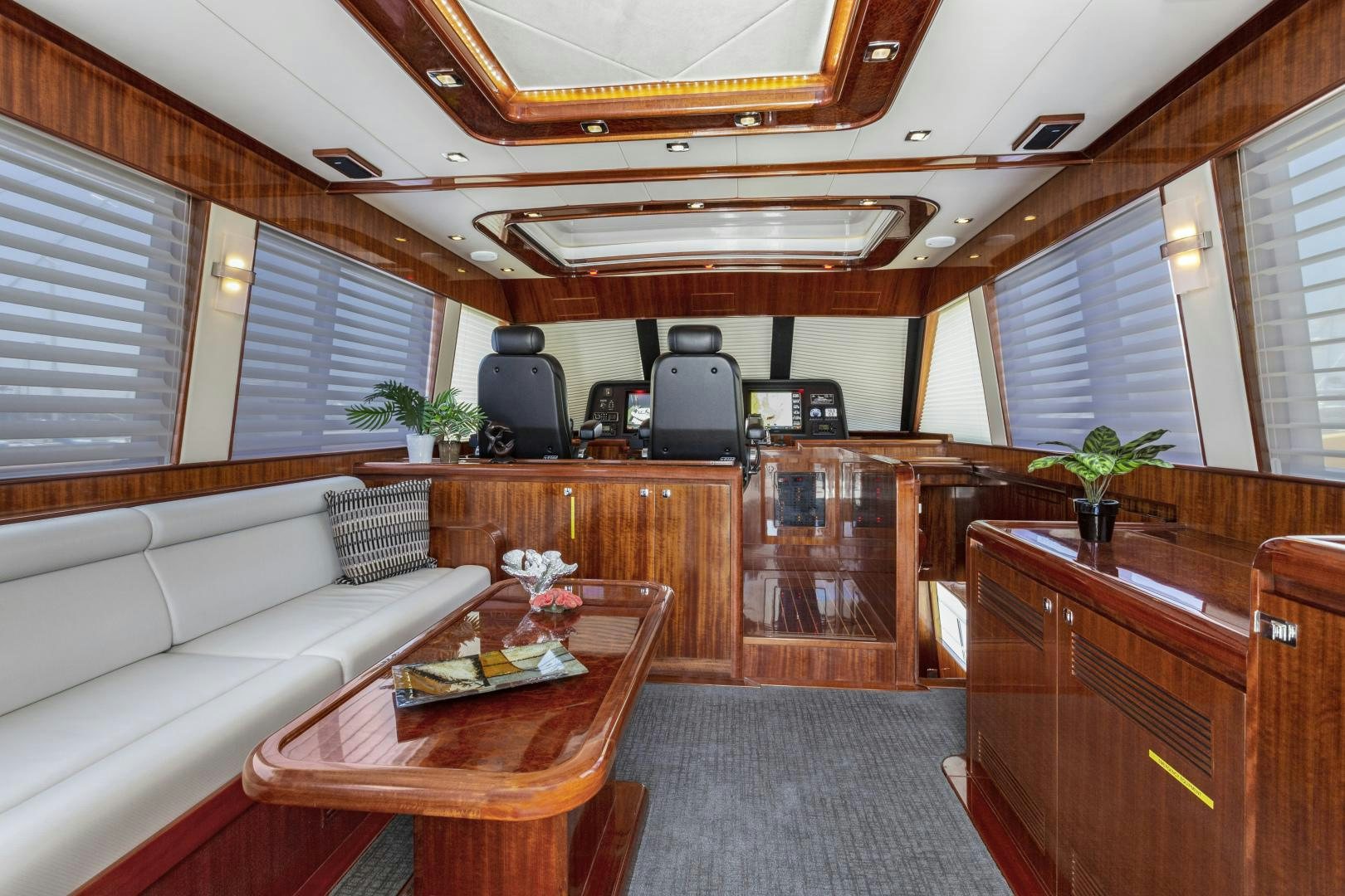 a living room with a couch and a coffee table aboard ODYSEA Yacht for Sale