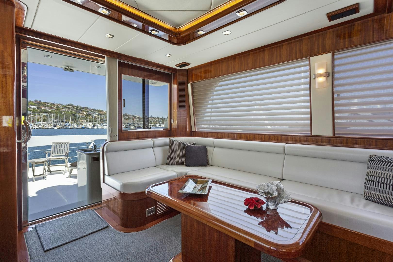 a living room with a large window aboard ODYSEA Yacht for Sale
