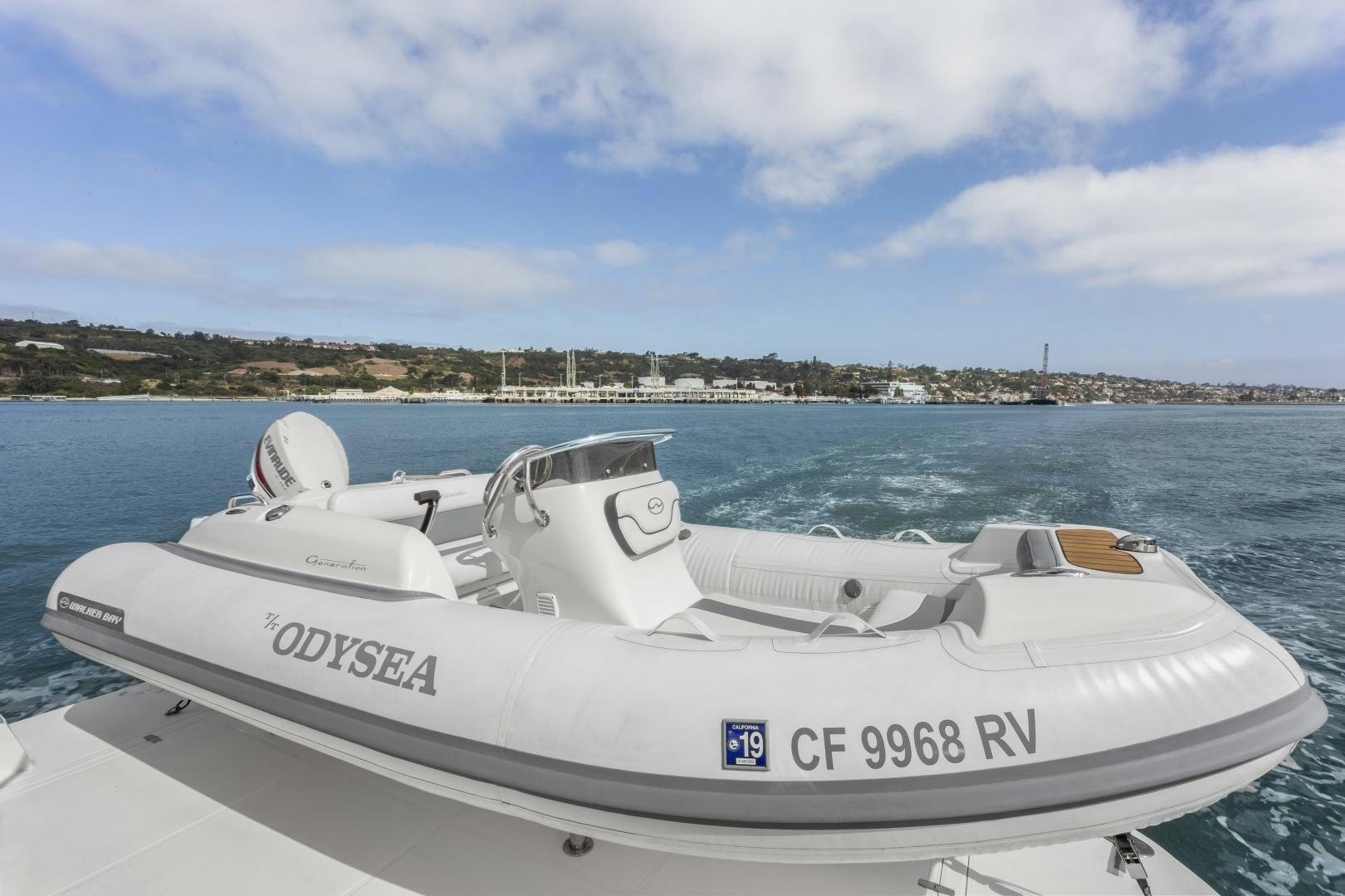 a white boat on the water aboard ODYSEA Yacht for Sale