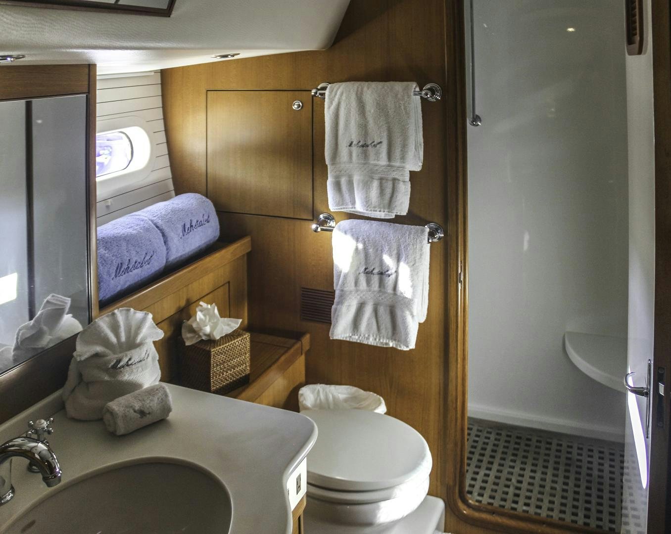 a bathroom with a toilet and sink aboard MEHETABEL Yacht for Sale