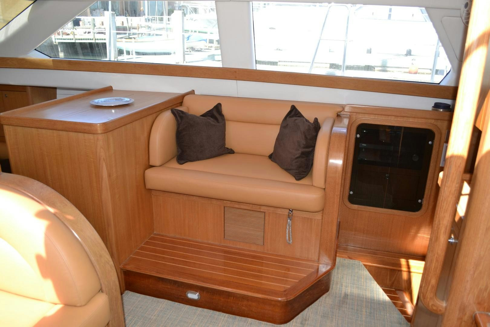 a couch with a pillow on it aboard MEHETABEL Yacht for Sale