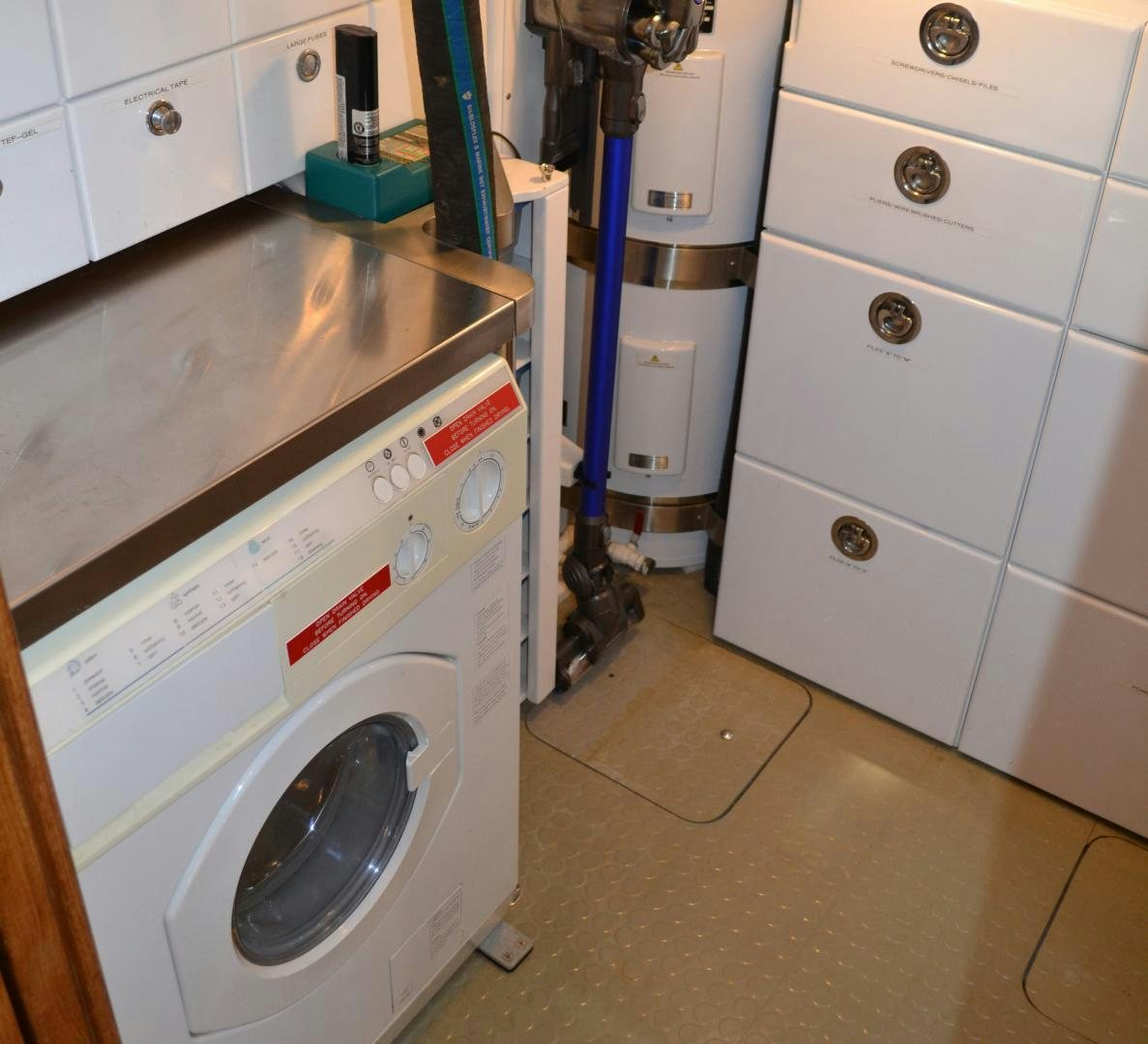 a laundry room with a washing machine aboard MEHETABEL Yacht for Sale