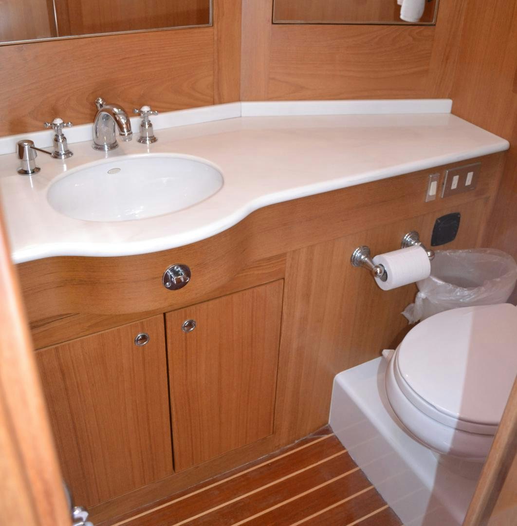 a bathroom with a sink and toilet aboard MEHETABEL Yacht for Sale