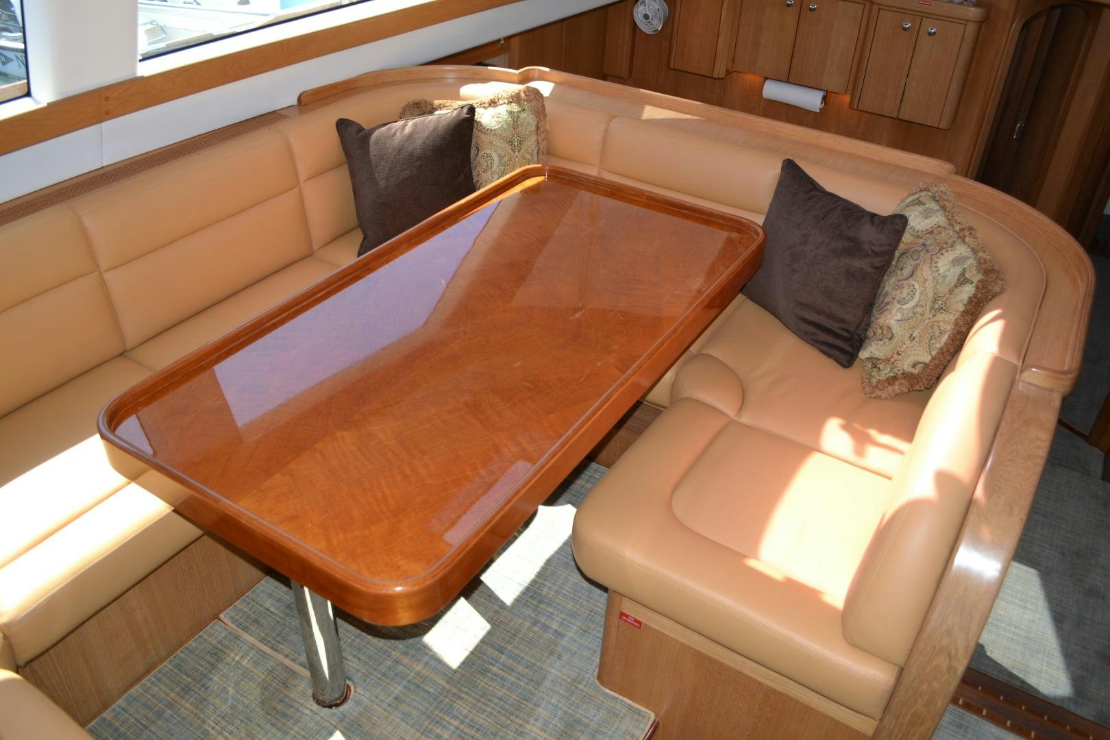 a couch and a chair in a room aboard MEHETABEL Yacht for Sale