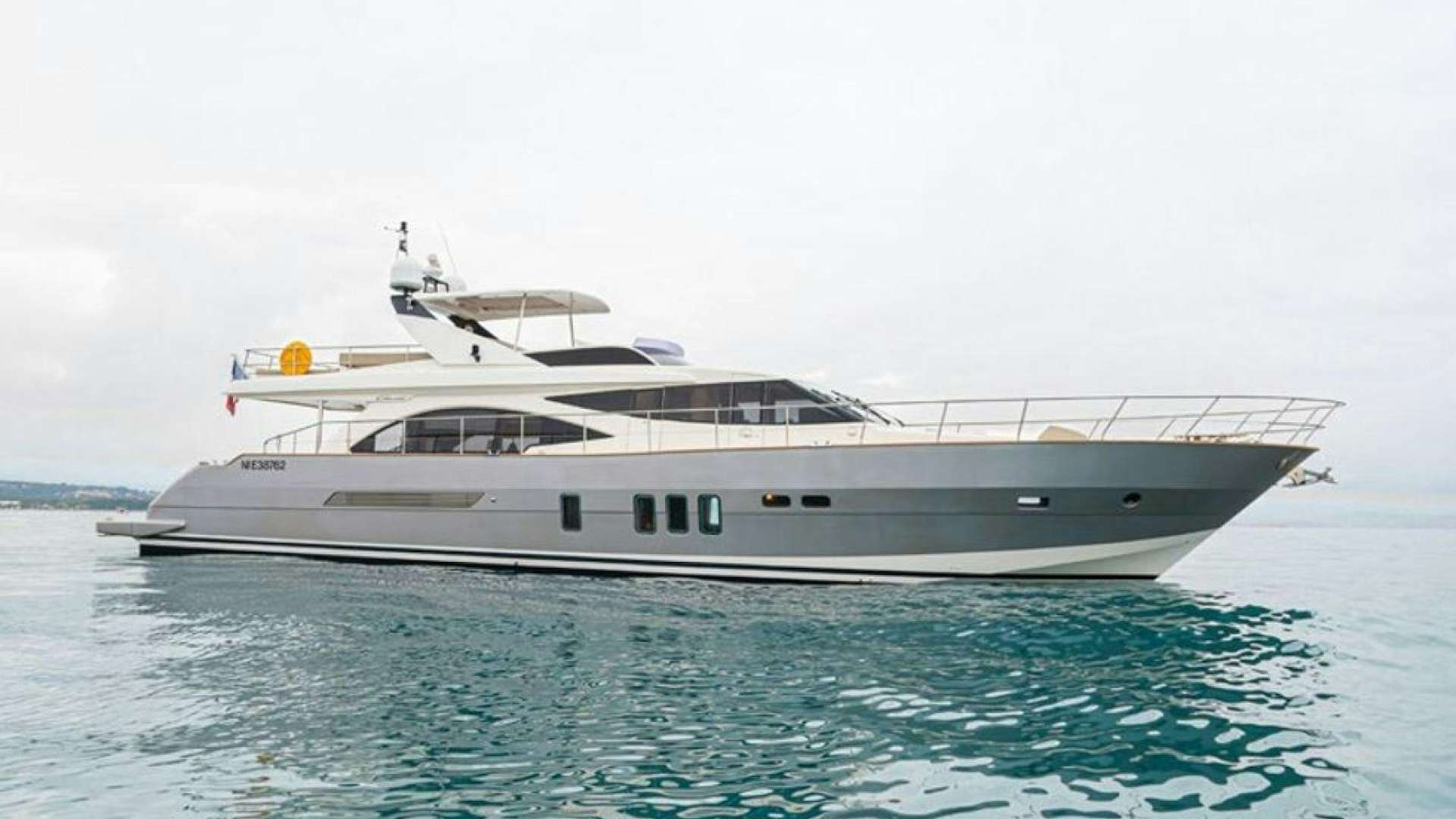 a white yacht in the water aboard PASSION V Yacht for Sale