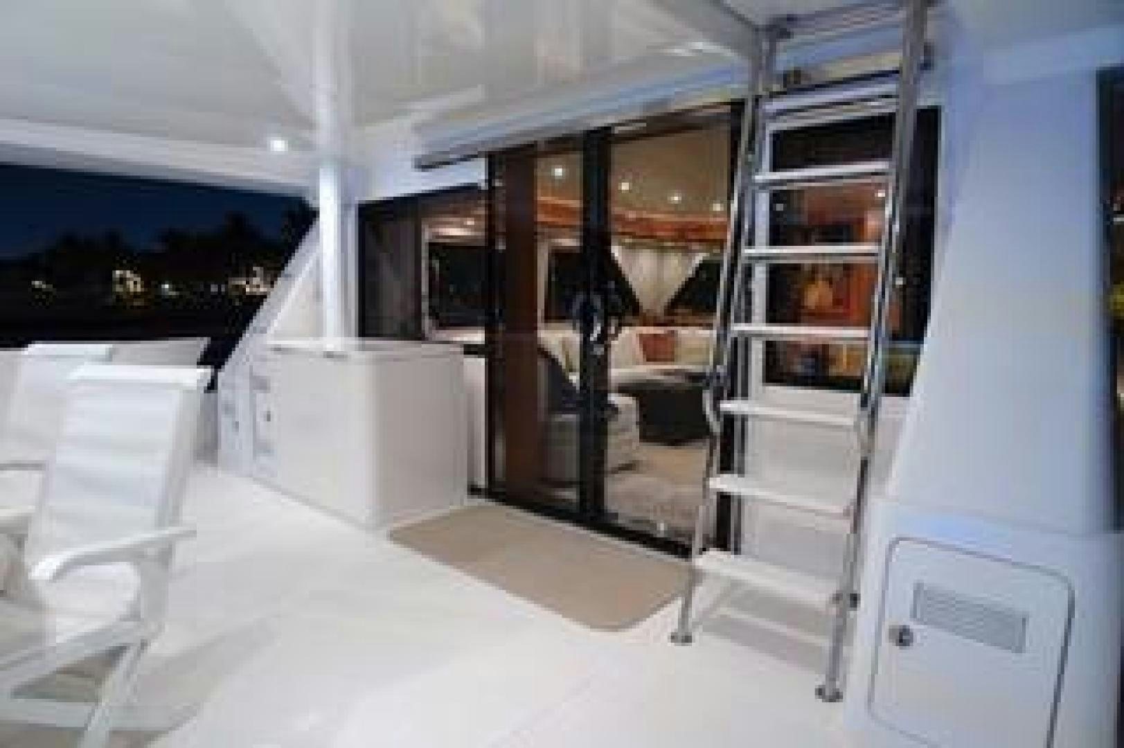 a room with a ladder and shelves aboard No Name Yacht for Sale