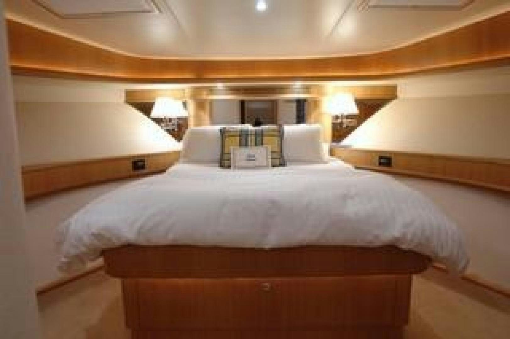 a bed with white sheets aboard No Name Yacht for Sale