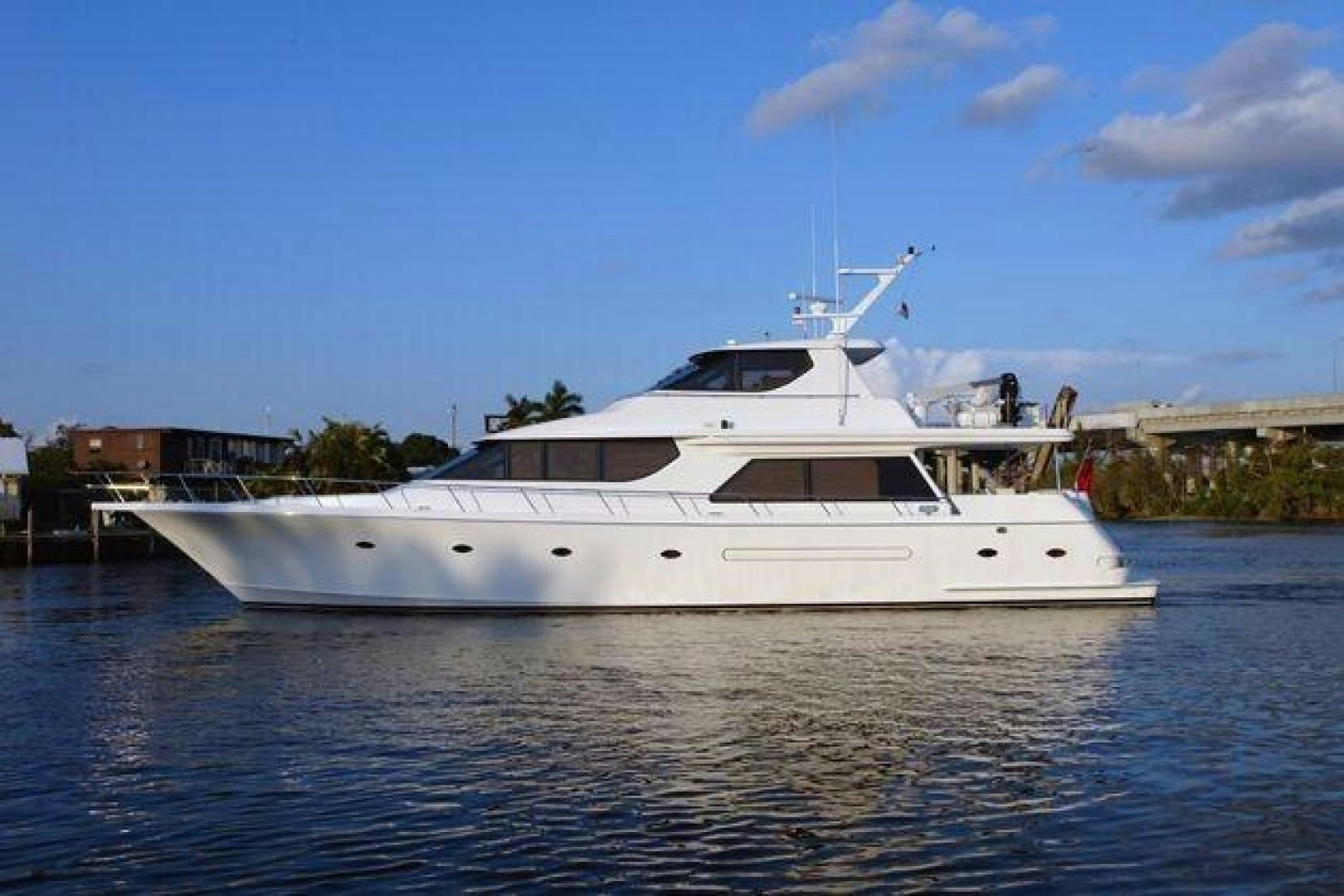 a white yacht on the water aboard No Name Yacht for Sale