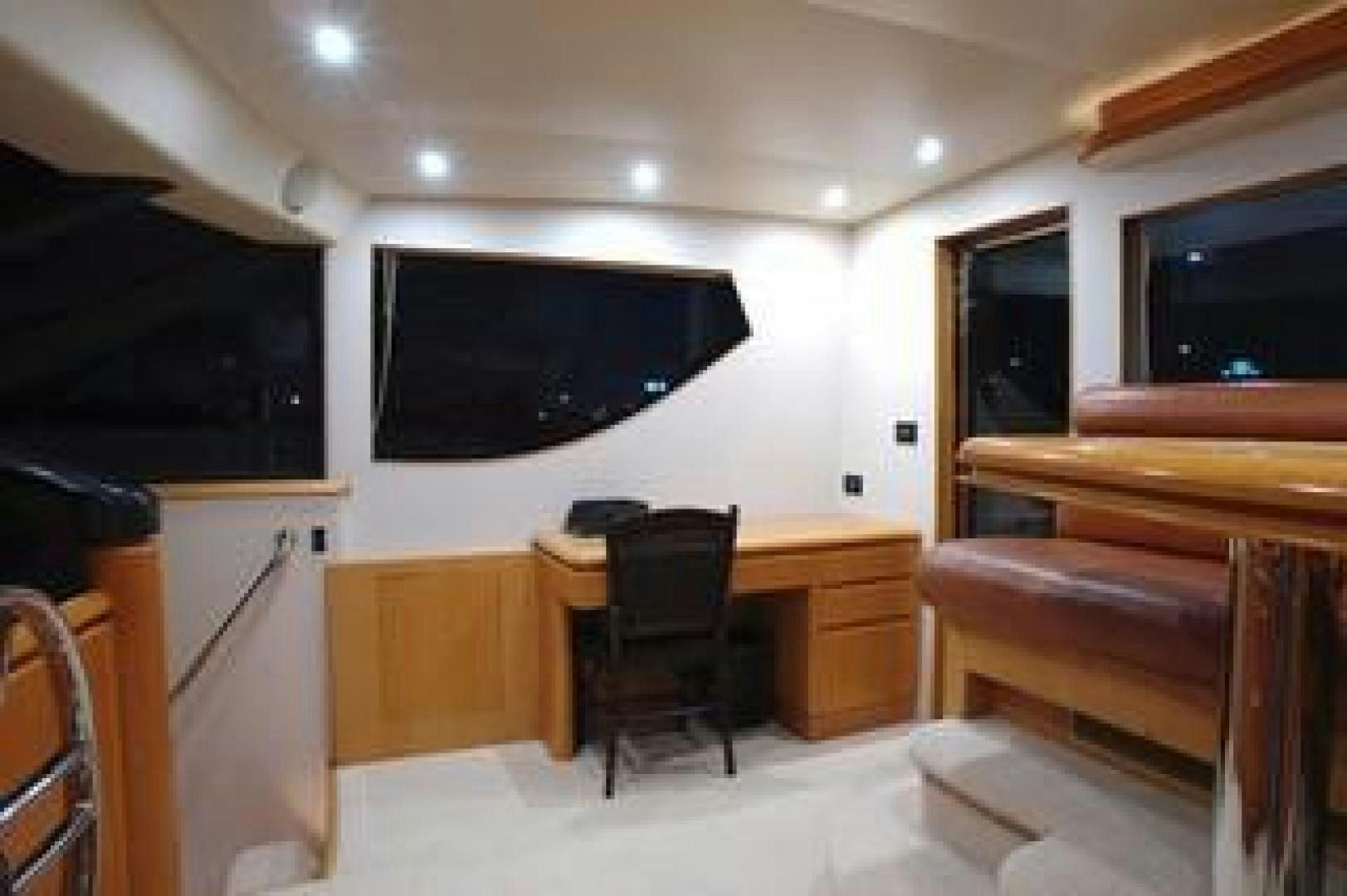 a room with a tv and a desk aboard No Name Yacht for Sale