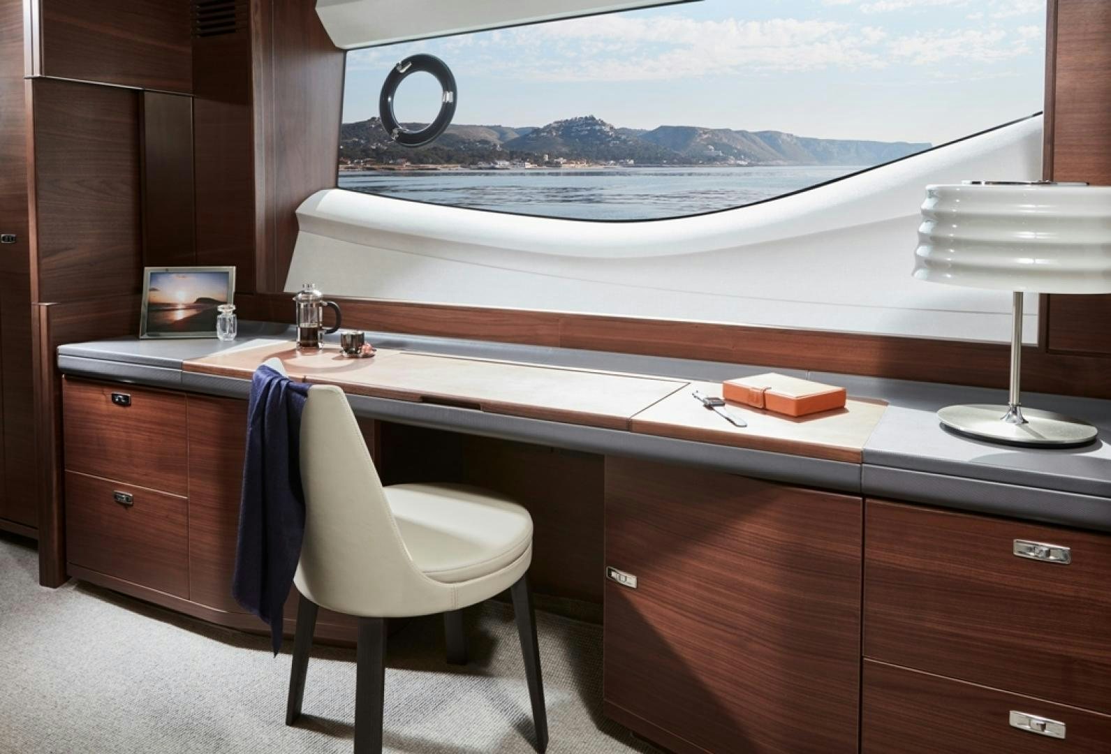 a desk with a chair and a window aboard S78  Yacht for Sale
