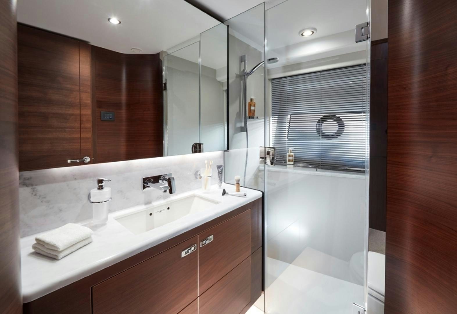a bathroom with a large mirror aboard S78  Yacht for Sale