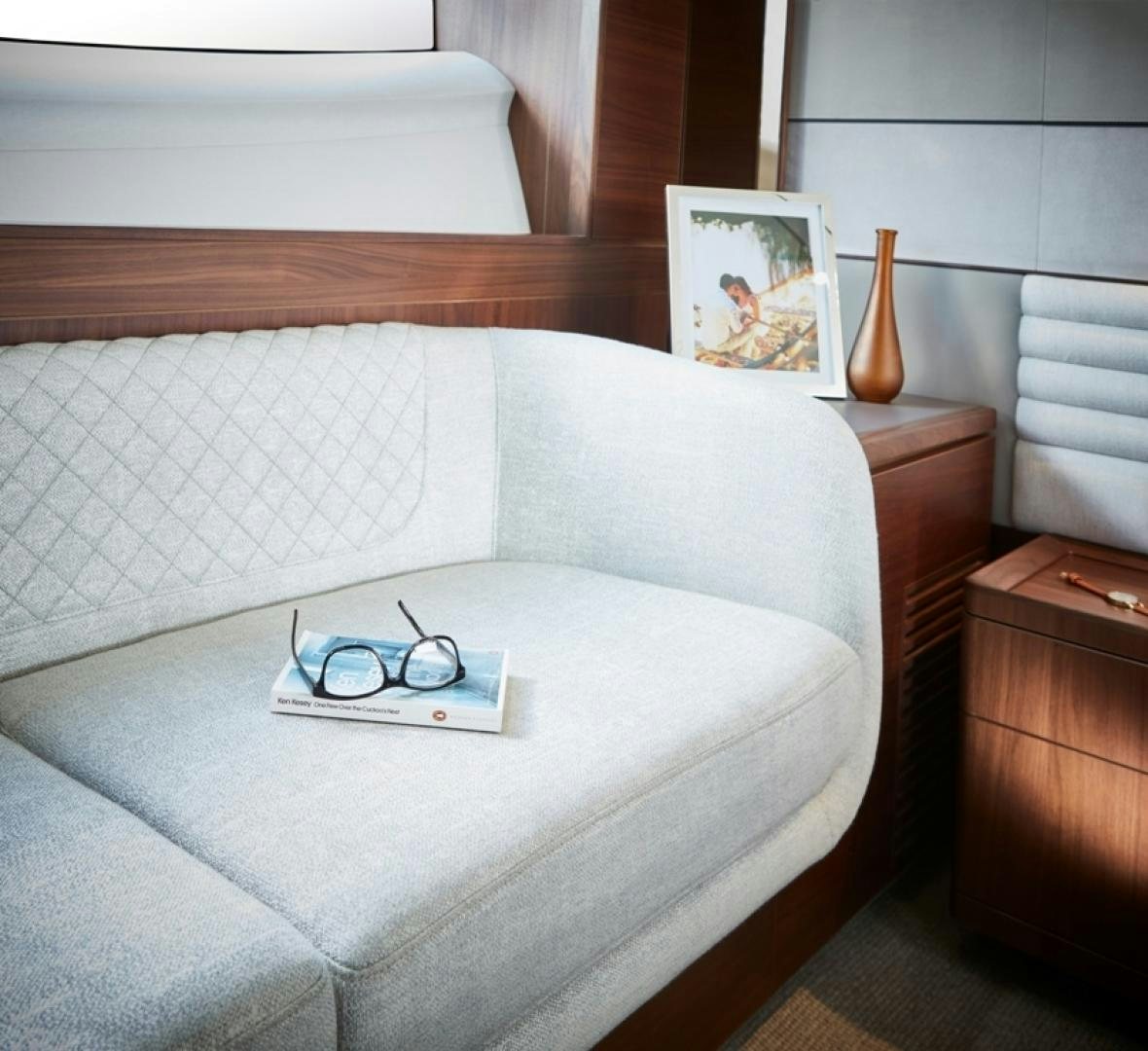 a bed with a white sheet and a picture on the wall aboard S78  Yacht for Sale