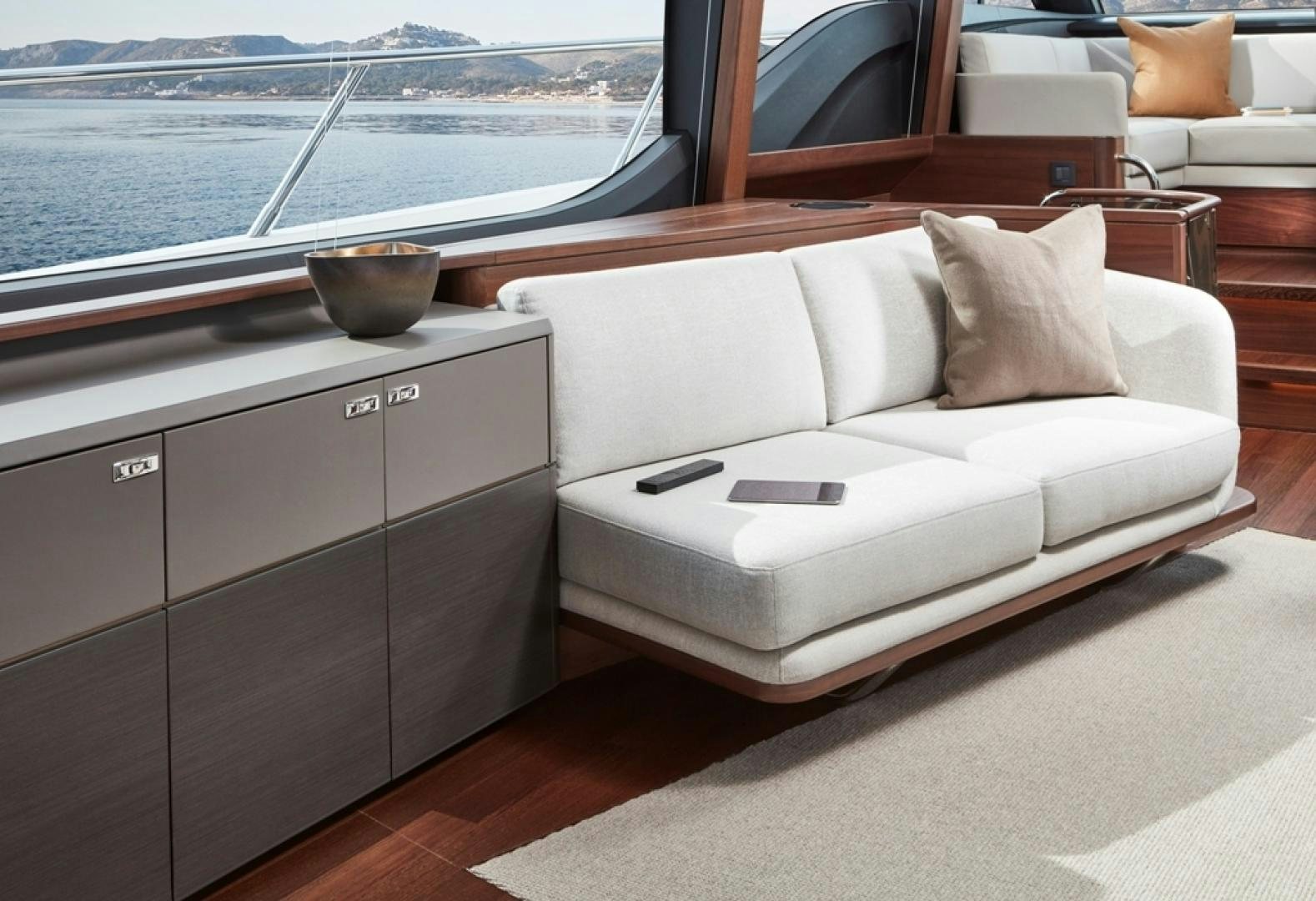 a white couch in a room aboard S78  Yacht for Sale