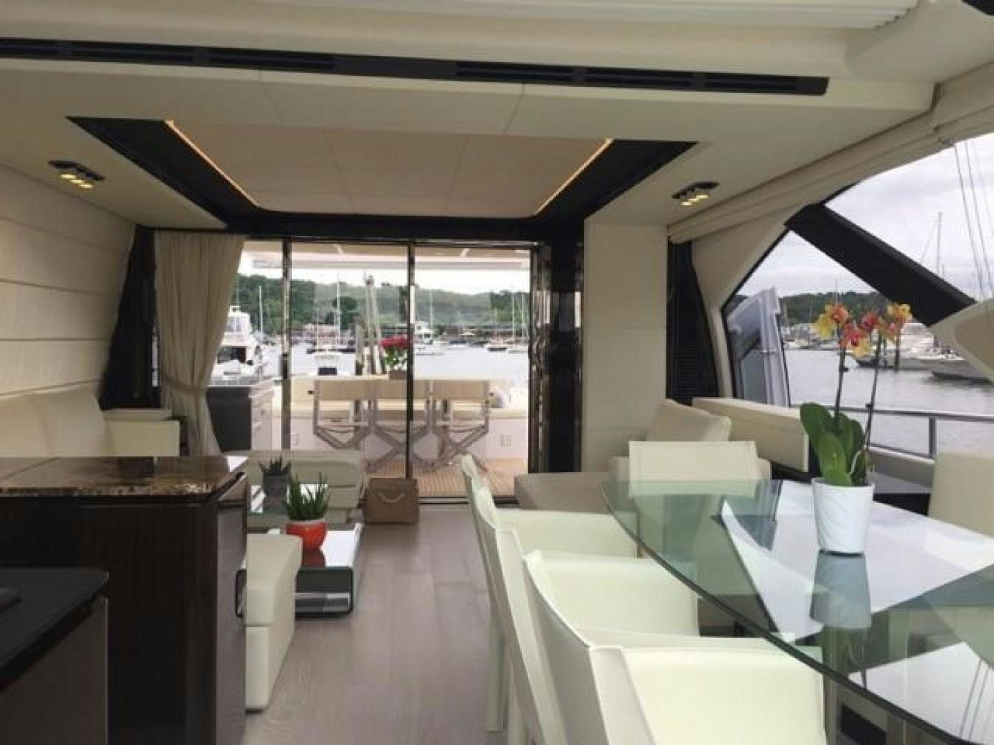 a room with a table chairs and plants aboard SILVER SKY 2.0 Yacht for Sale