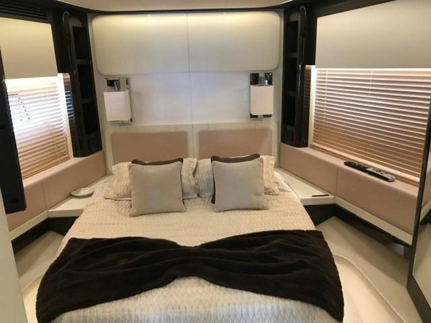 a bed with a black blanket aboard SILVER SKY 2.0 Yacht for Sale